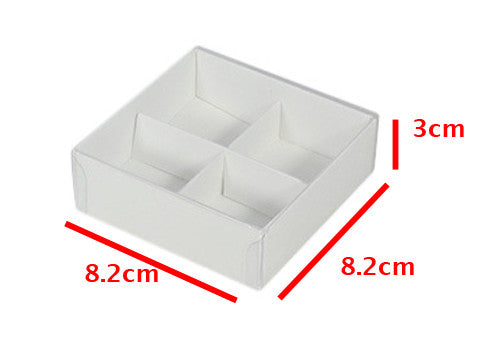A set of 10 white gift boxes with clear lids, designed for chocolates and petite treats, featuring dividers for organized storage.