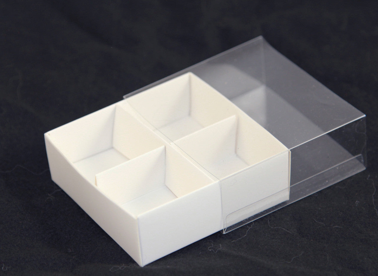 A set of 10 white gift boxes with clear lids, designed for chocolates and petite treats, featuring dividers for organized storage.