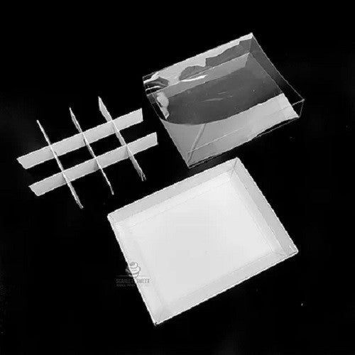 A set of 10 elegant white gift boxes with clear plastic lids, designed for chocolates and small gifts, showcasing their compartments and flat-packed design.