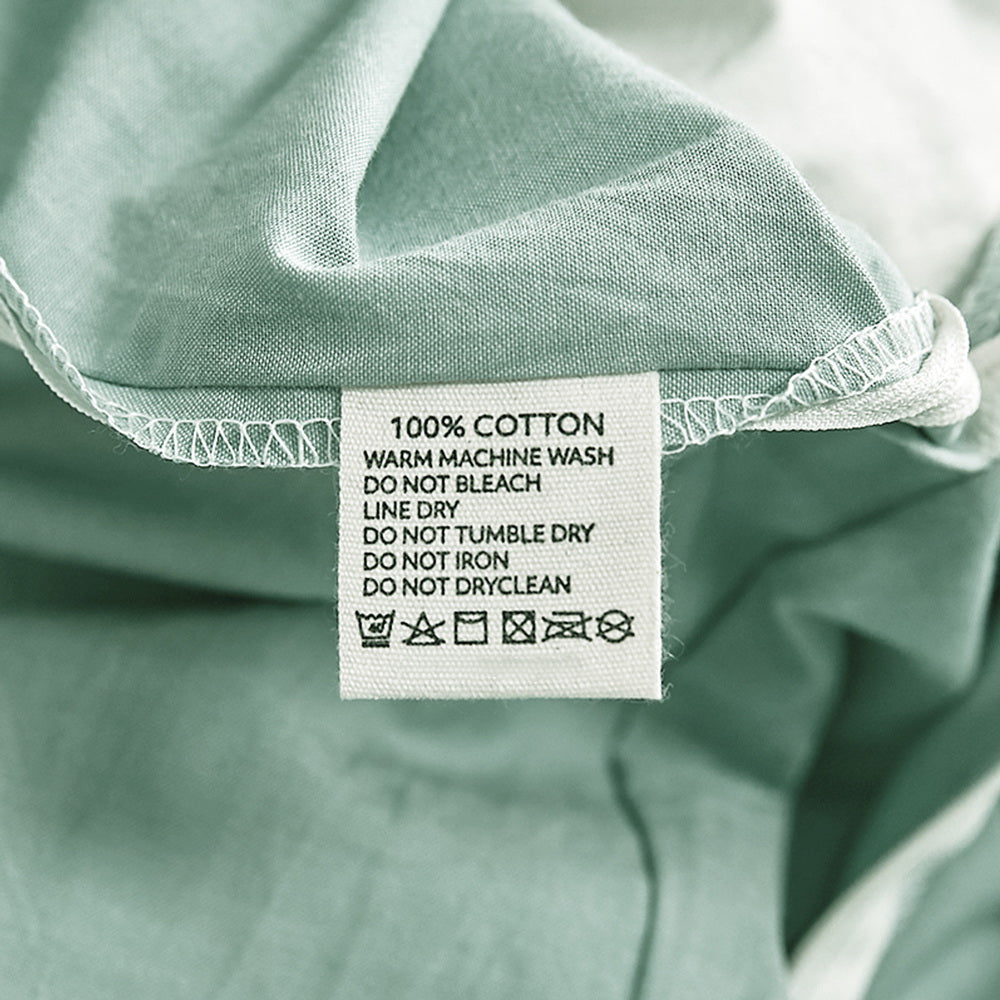 100% washed cotton quilt set in green, featuring a textured design, lightweight fabric, and included pillowcases, perfect for cozy bedding.