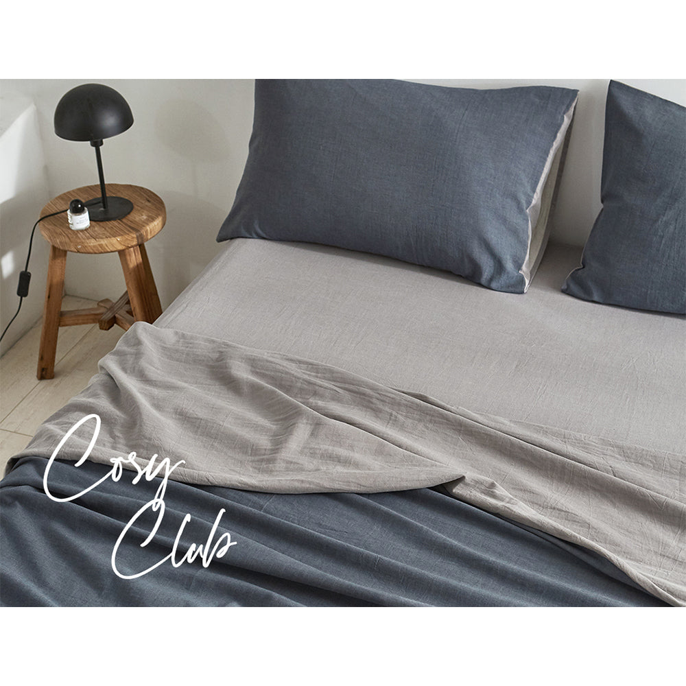 Cosy Club 100% Washed Cotton Sheet Set in Dark Blue Grey, featuring a flat sheet, fitted sheet, and two pillowcases, showcasing a soft and elegant design.