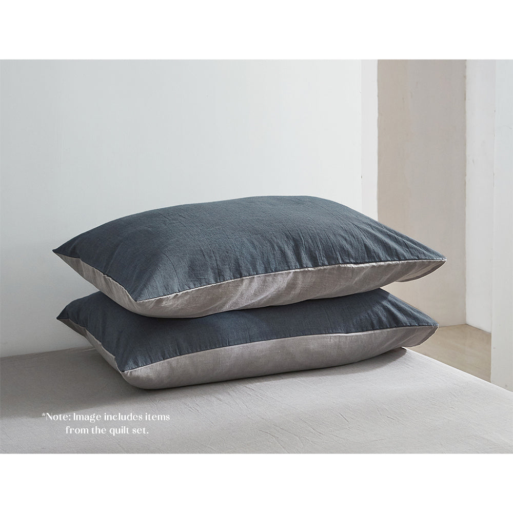 100% washed cotton sheet set in blue and dark grey, featuring a soft texture and lightweight design, perfect for year-round comfort.