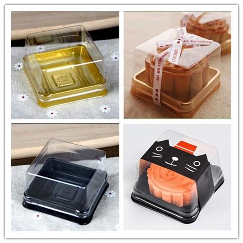 100pcs Mini Clear Plastic Cake Boxes with dome shape top and black bottom, ideal for cupcakes and desserts.