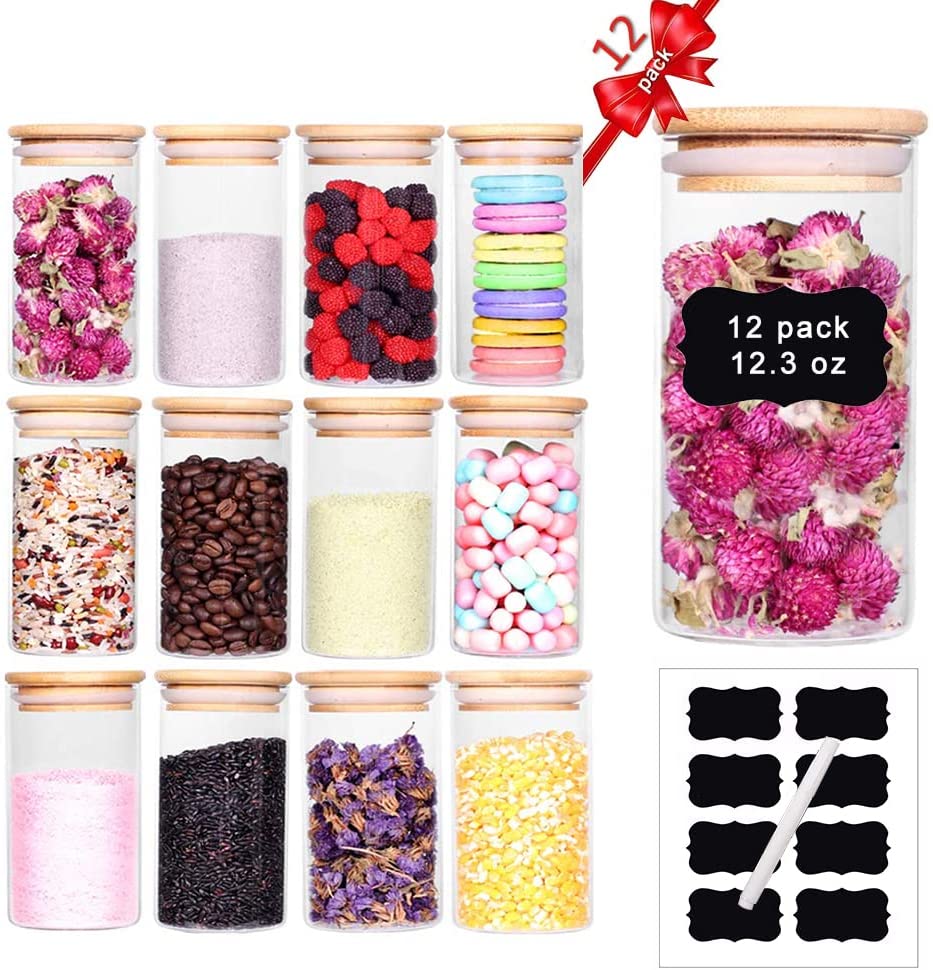 Set of 12 glass spice jars with airtight bamboo lids, neatly arranged on a kitchen countertop, showcasing their clear design and labels.