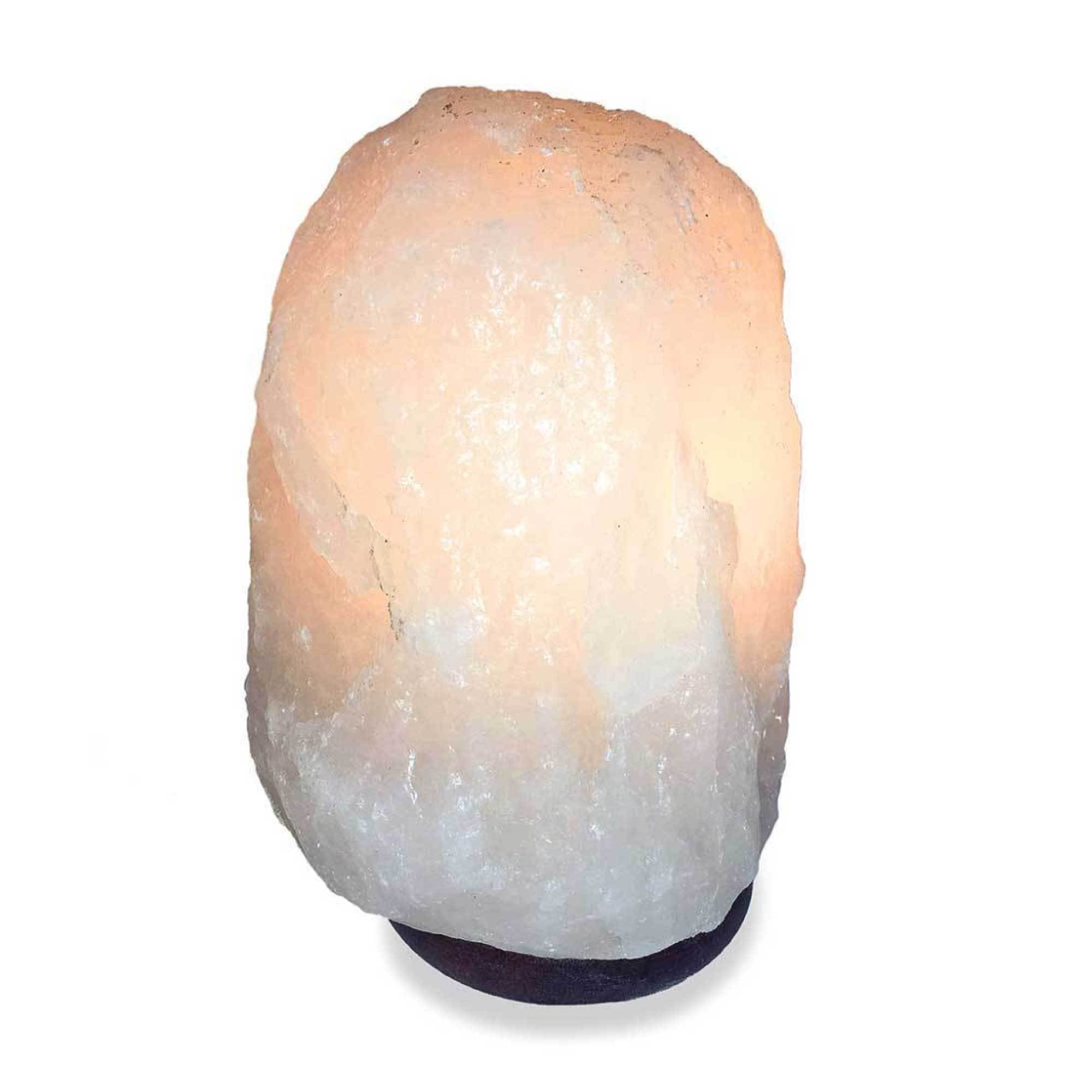 A beautifully shaped Himalayan white salt lamp glowing softly, showcasing its natural rock salt texture and wooden base.