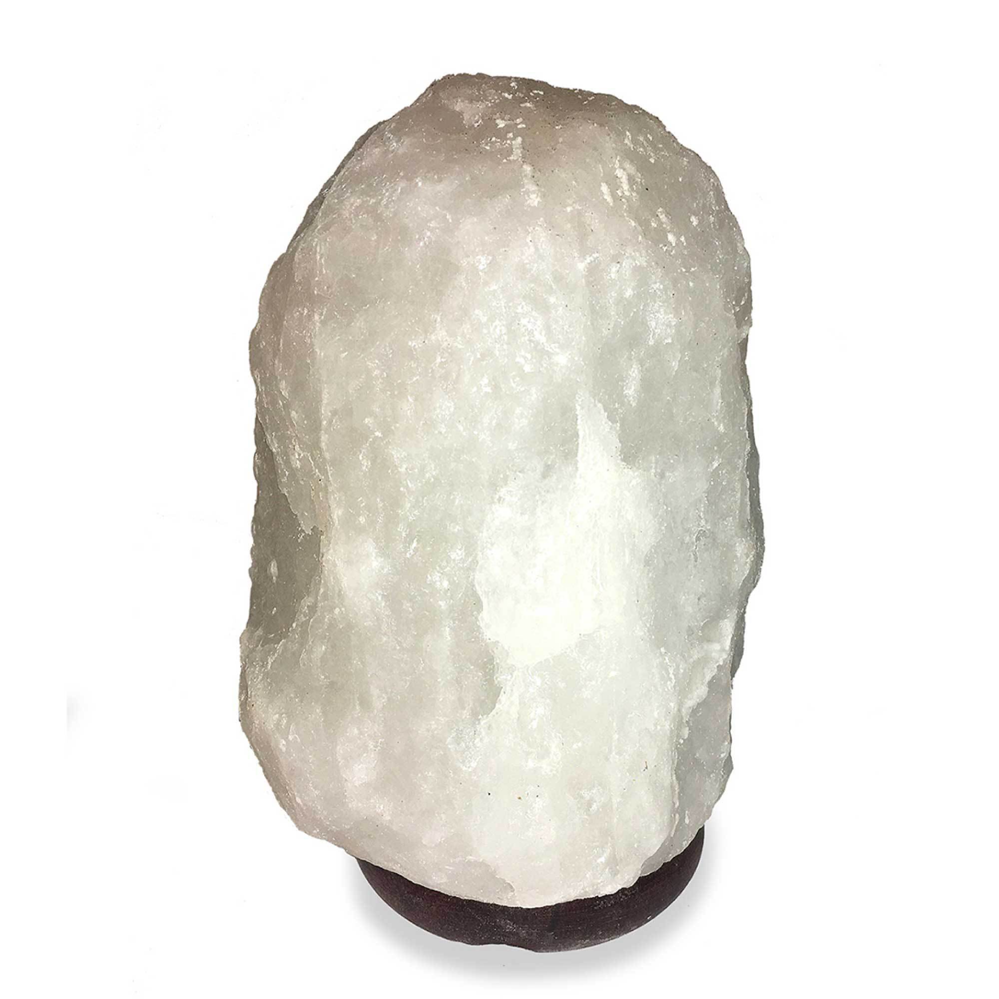 A beautifully shaped Himalayan white salt lamp glowing softly, showcasing its natural rock salt texture and wooden base.