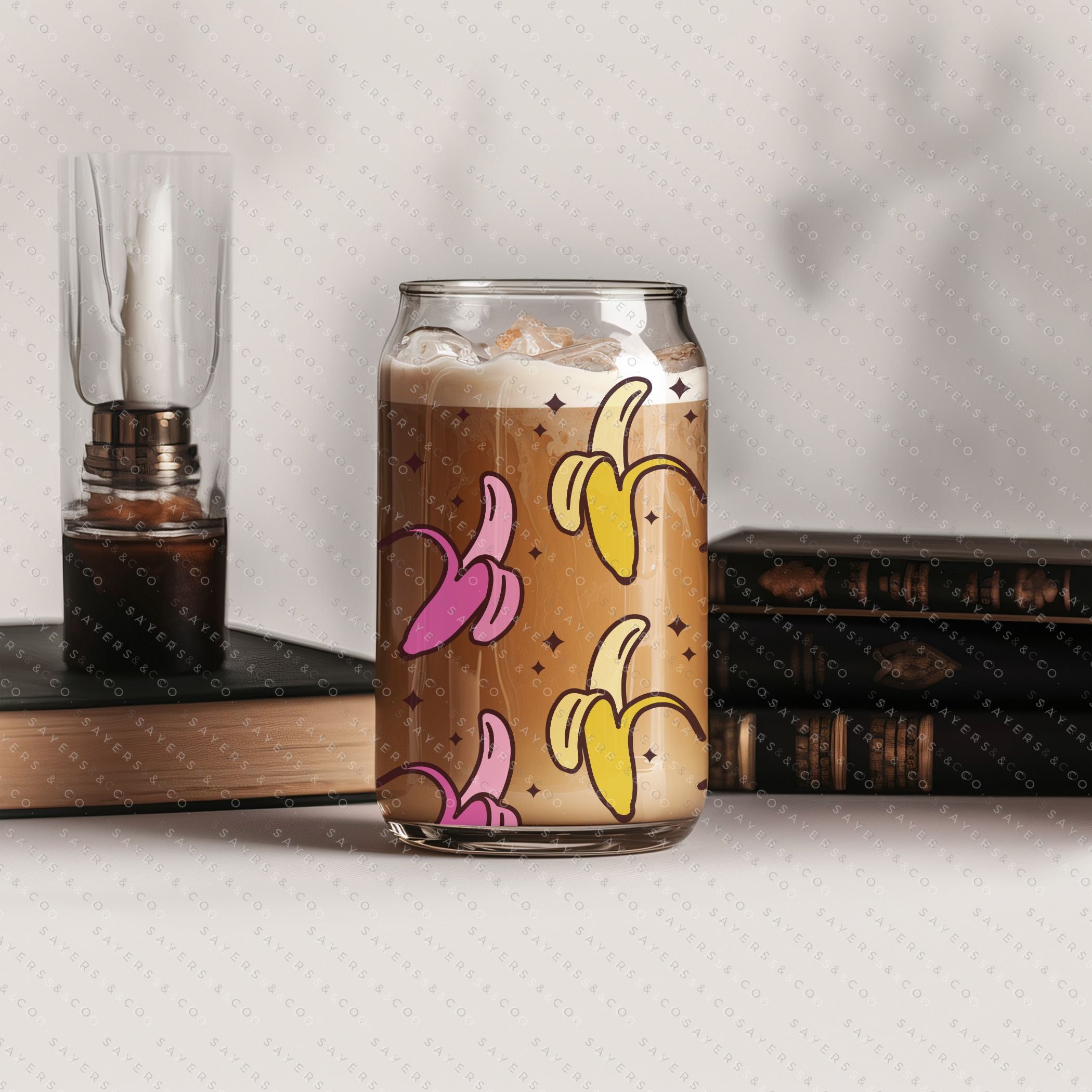 16oz Banana Split Glass Cup with Bamboo Lid and Straw, showcasing a clear glass design perfect for beverages.