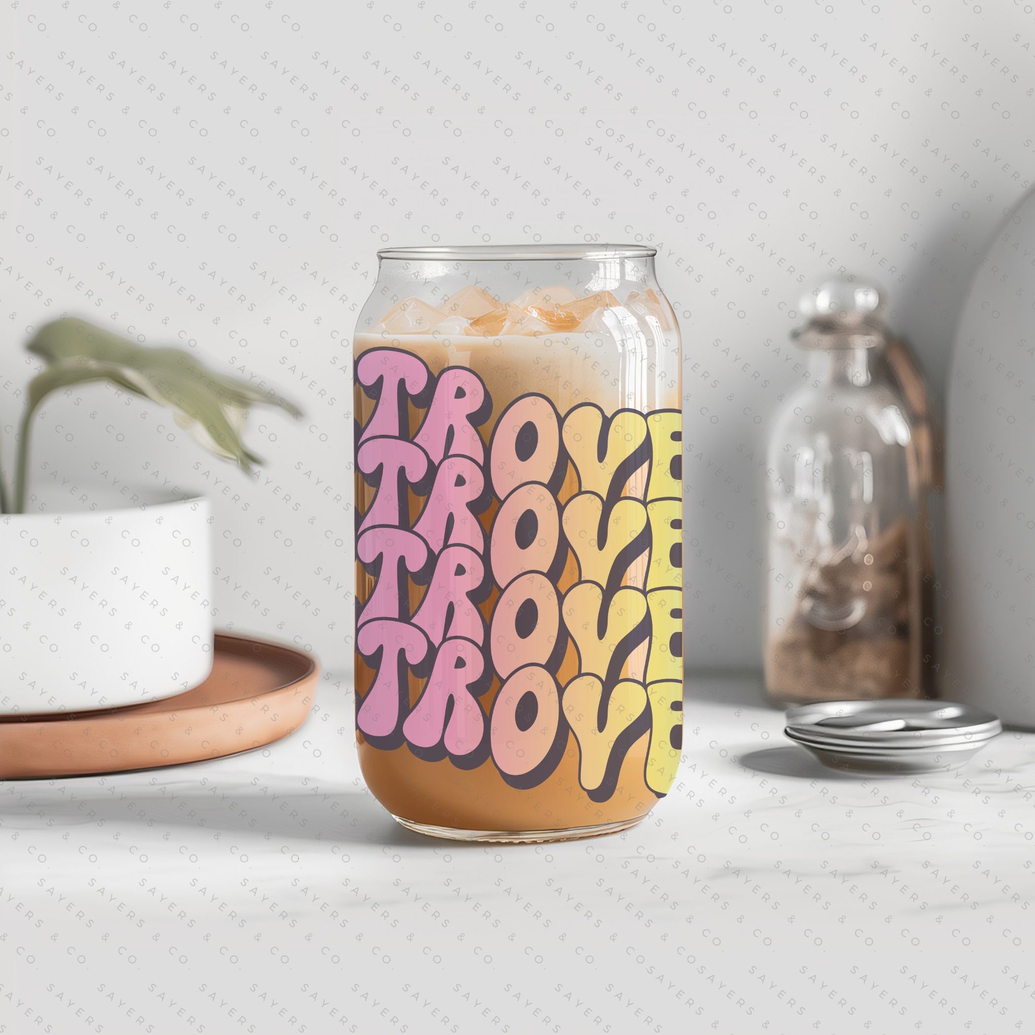 16oz Booktrovert Glass Cup featuring a bamboo lid and clear straw, perfect for iced coffee and other beverages.