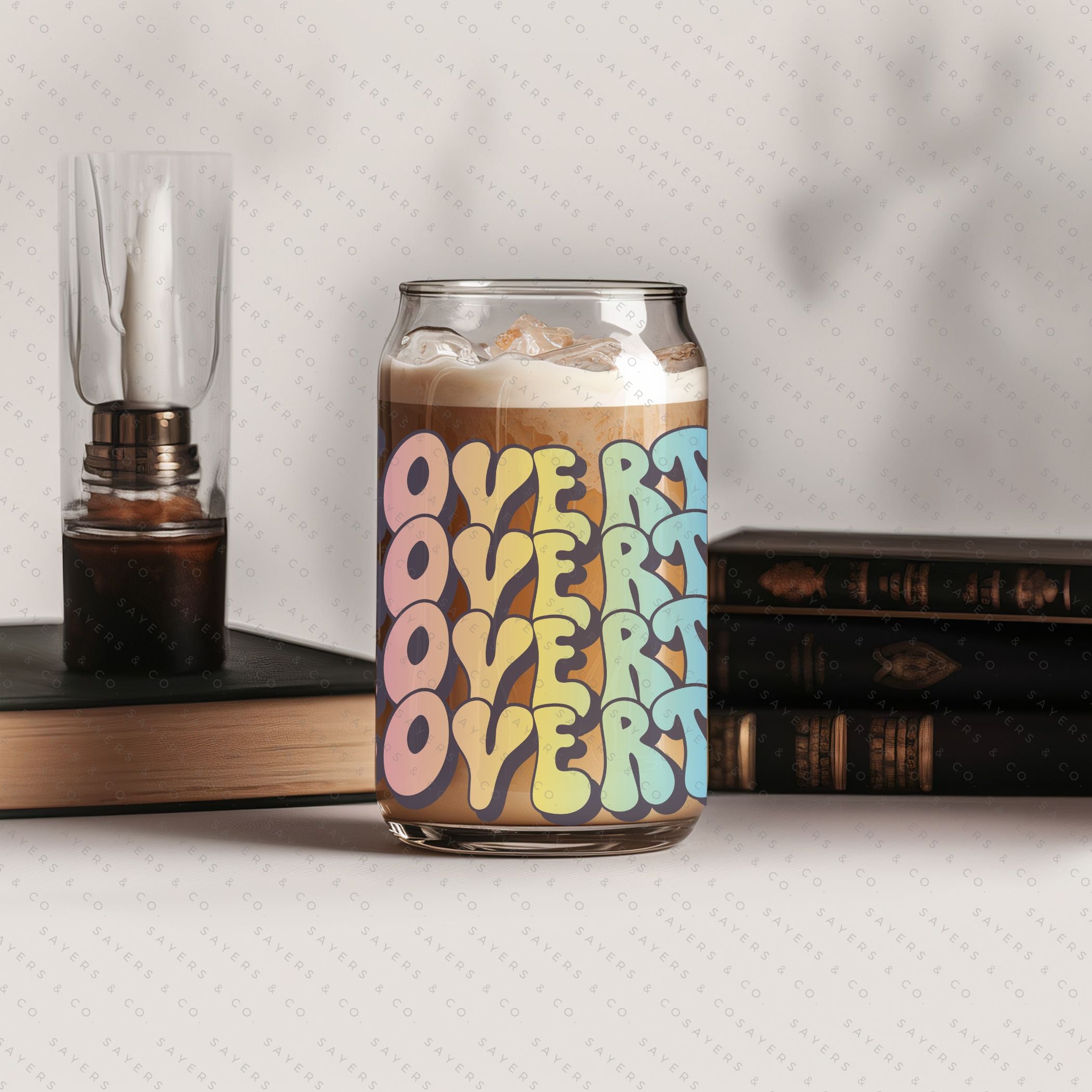 16oz Booktrovert Glass Cup featuring a bamboo lid and clear straw, perfect for iced coffee and other beverages.