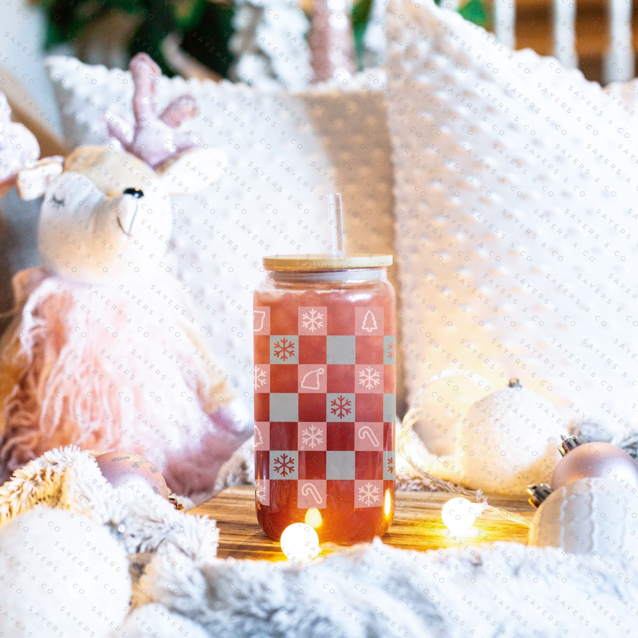 16oz Christmas Checkers Glass Cup featuring a bamboo lid and straw, perfect for festive drinks.
