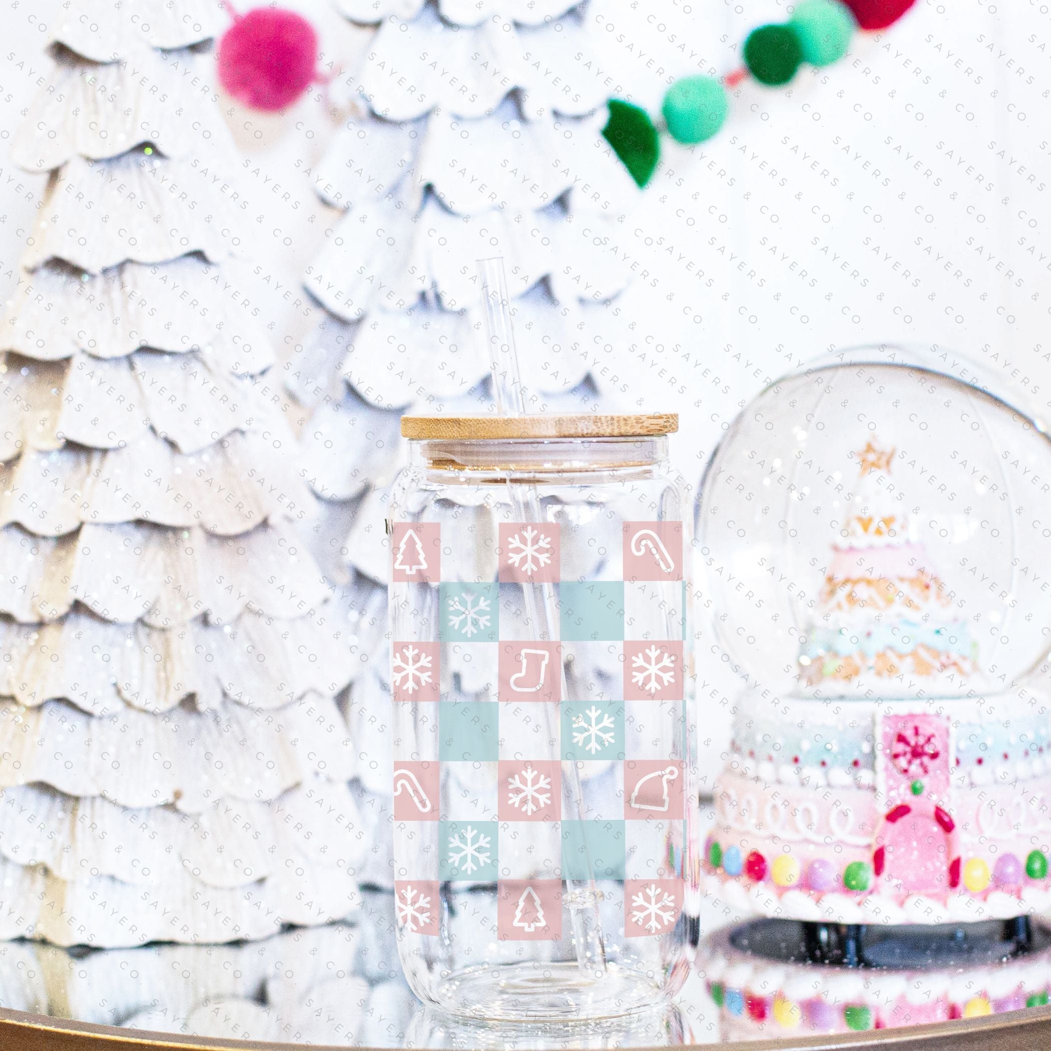 16oz Christmas Checkers Glass Cup featuring a bamboo lid and straw, perfect for festive drinks.