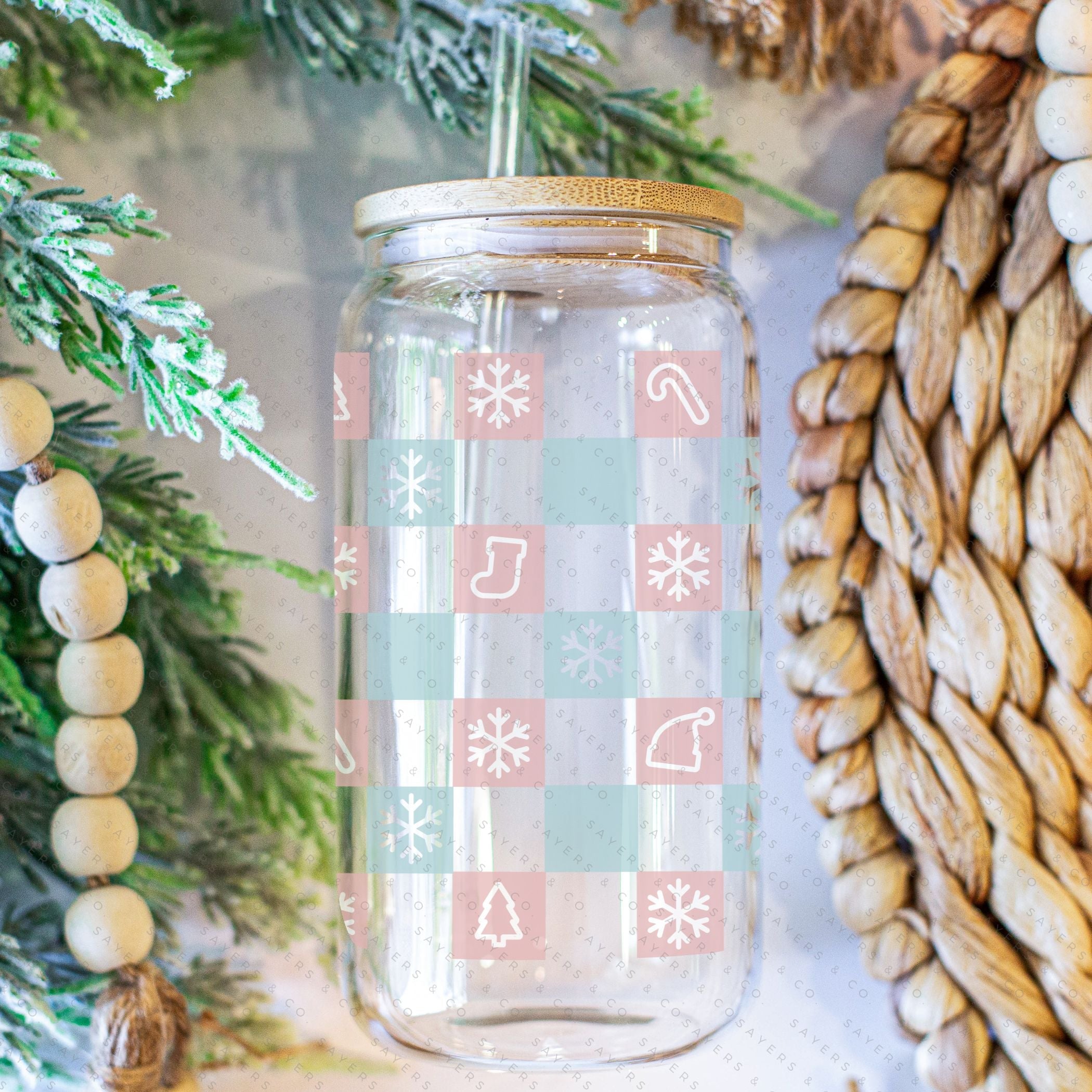 16oz Christmas Checkers Glass Cup featuring a bamboo lid and straw, perfect for festive drinks.
