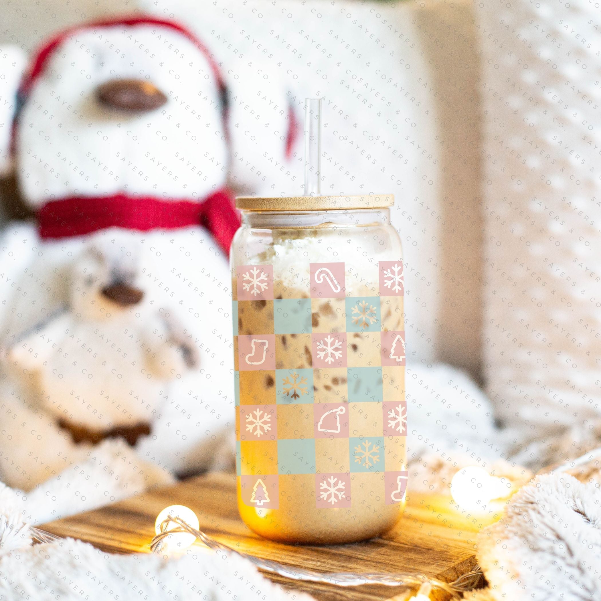 16oz Christmas Checkers Glass Cup featuring a bamboo lid and straw, perfect for festive drinks.