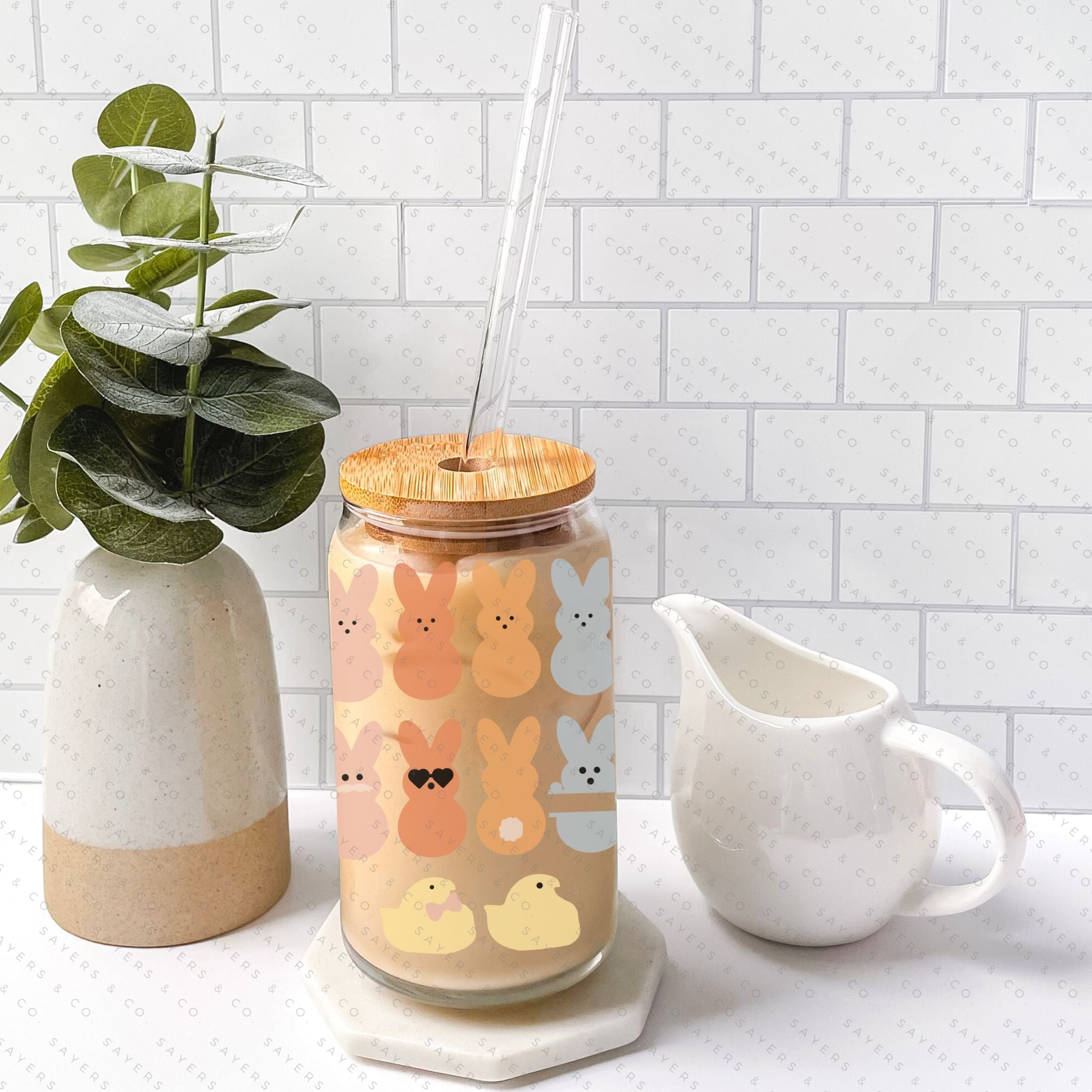 16oz Easter All the Peeps Glass Cup with bamboo lid and straw, featuring colorful Easter-themed designs.