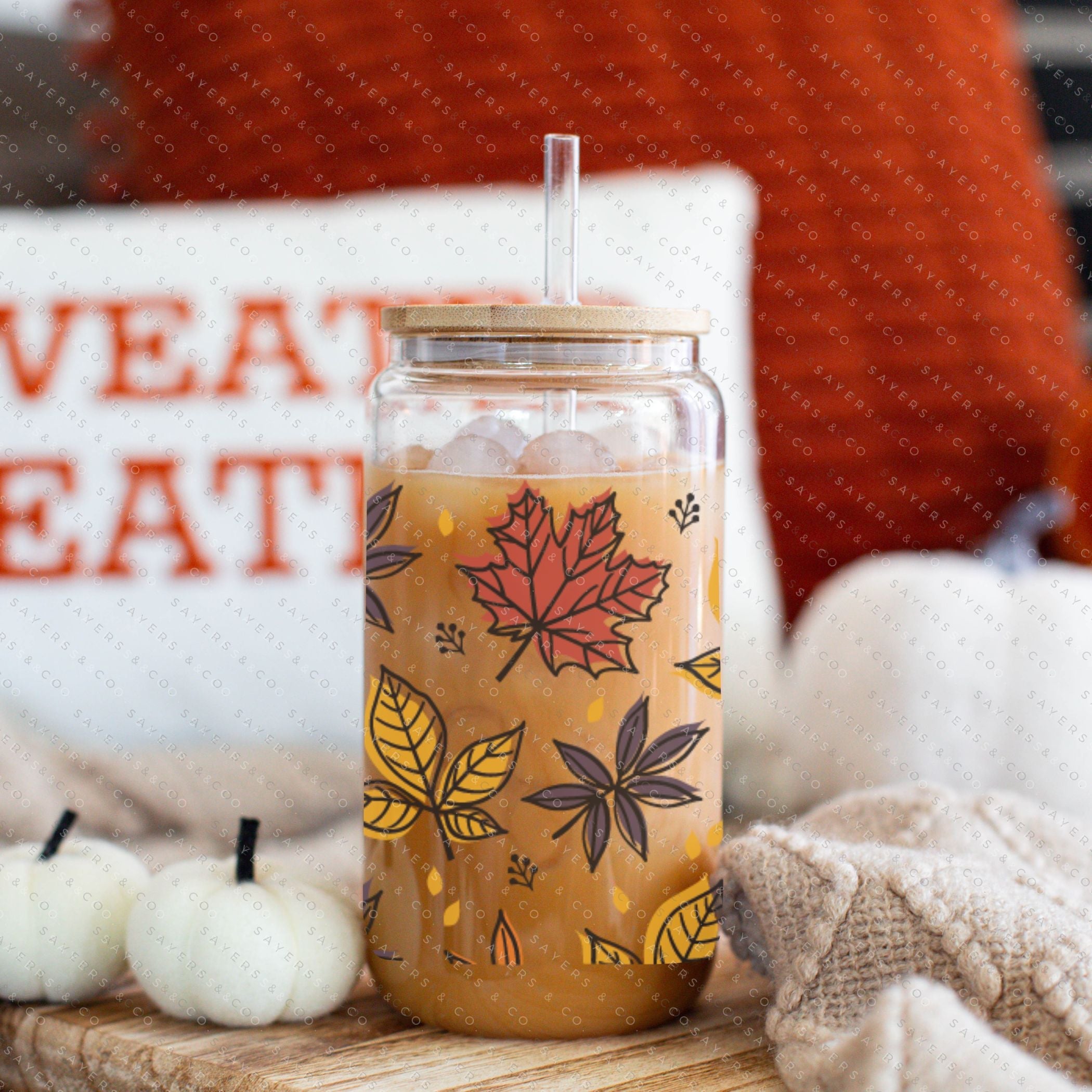 16oz Fall Leaves Glass Cup featuring a bamboo lid and straw, showcasing a beautiful autumn leaves design, perfect for seasonal beverages.