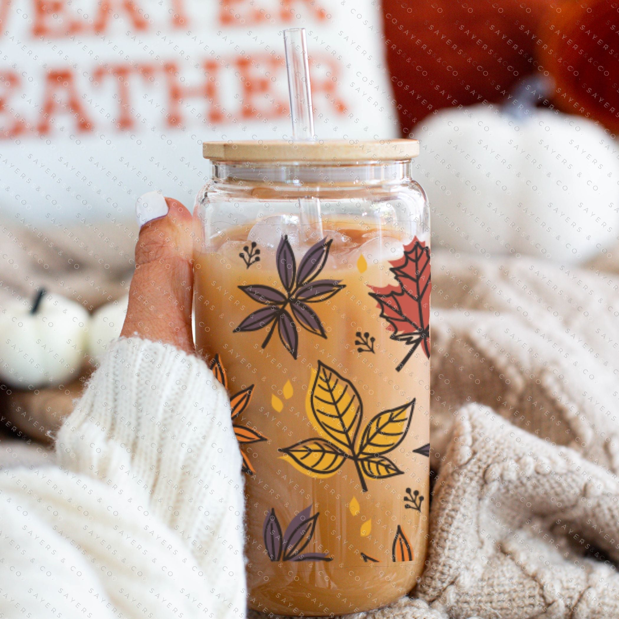 16oz Fall Leaves Glass Cup featuring a bamboo lid and straw, showcasing a beautiful autumn leaves design, perfect for seasonal beverages.