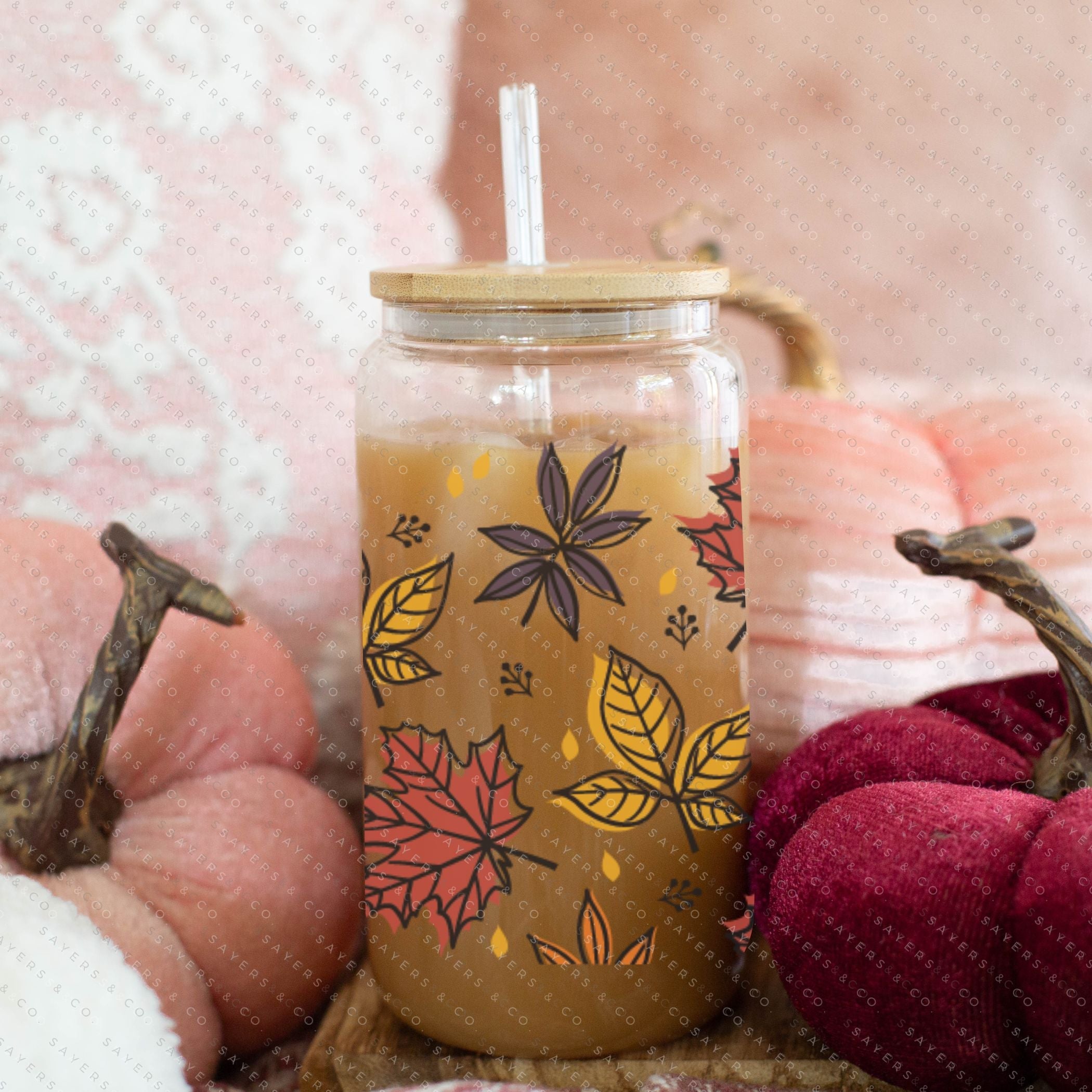 16oz Fall Leaves Glass Cup featuring a bamboo lid and straw, showcasing a beautiful autumn leaves design, perfect for seasonal beverages.
