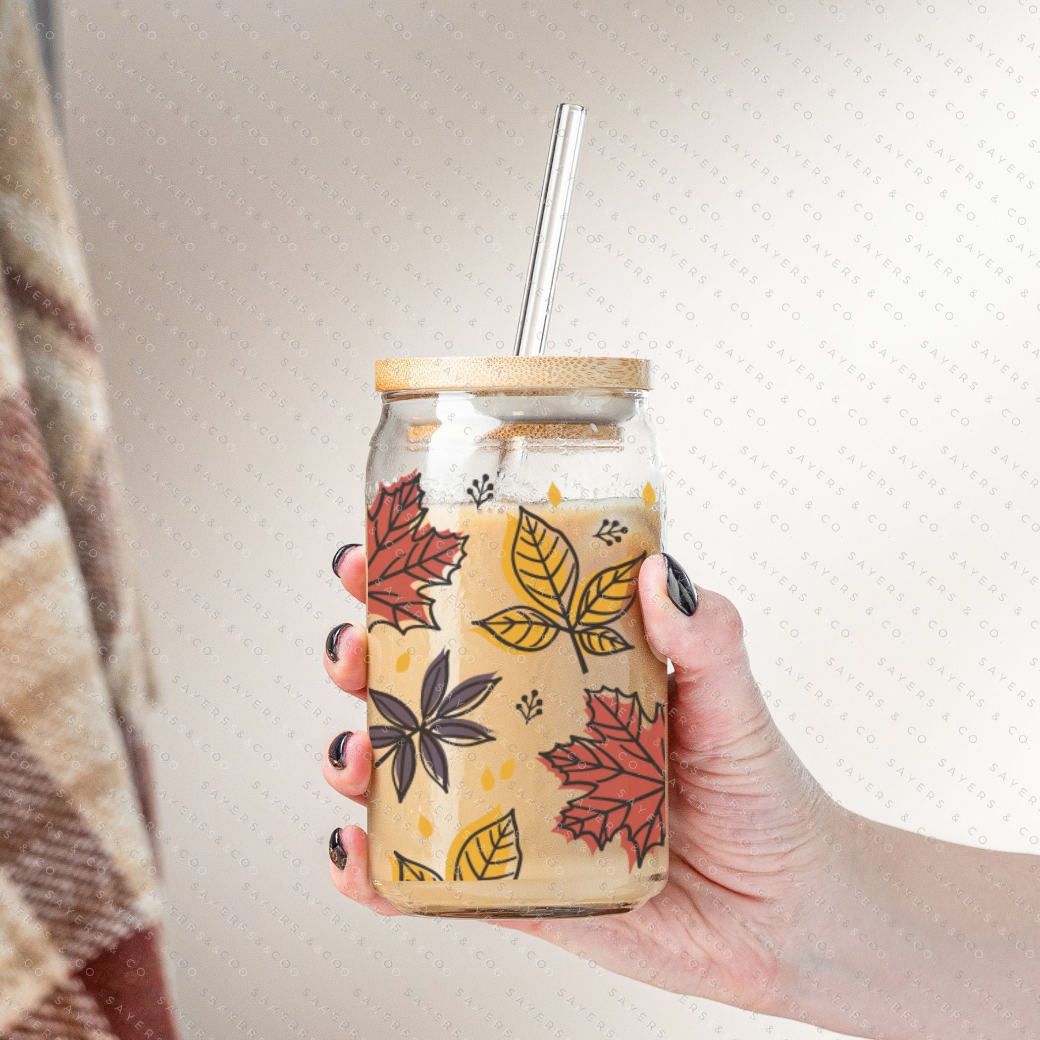 16oz Fall Leaves Glass Cup featuring a bamboo lid and straw, showcasing a beautiful autumn leaves design, perfect for seasonal beverages.