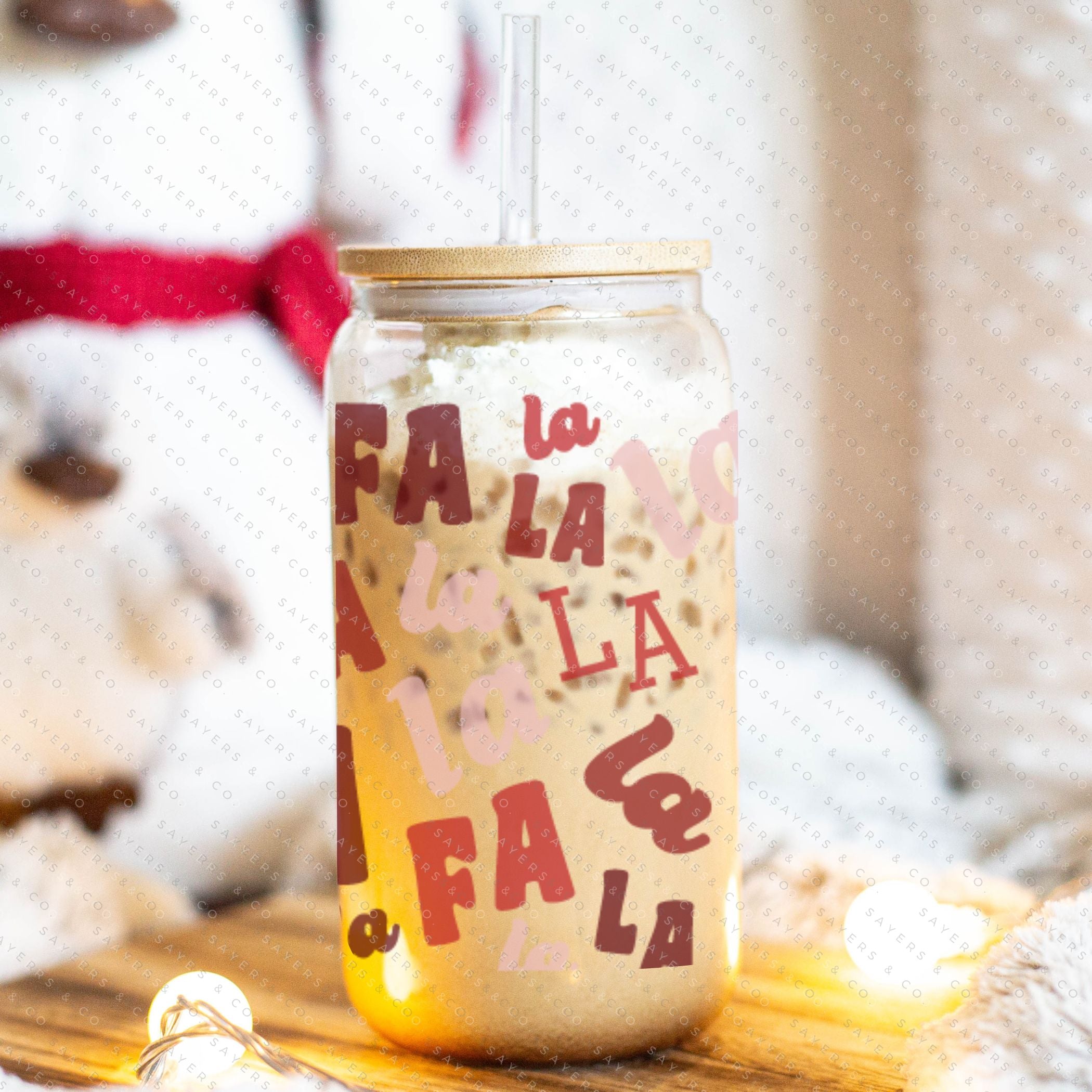 16oz Falala Christmas Lyrics Glass Cup featuring a bamboo lid and straw, perfect for festive drinks.