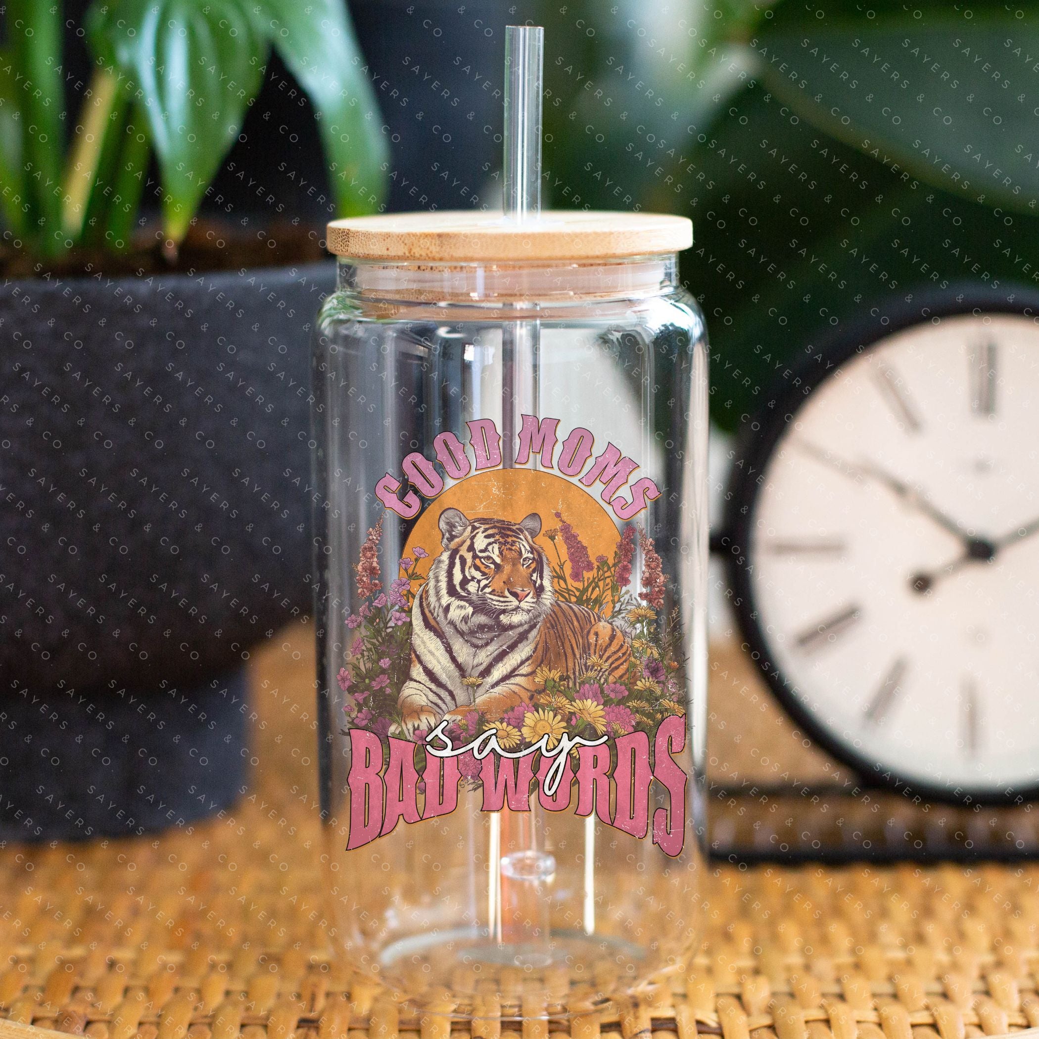 16oz Good Moms Say Bad Words Glass Cup with bamboo lid and straw, showcasing a humorous design perfect for moms and teachers.