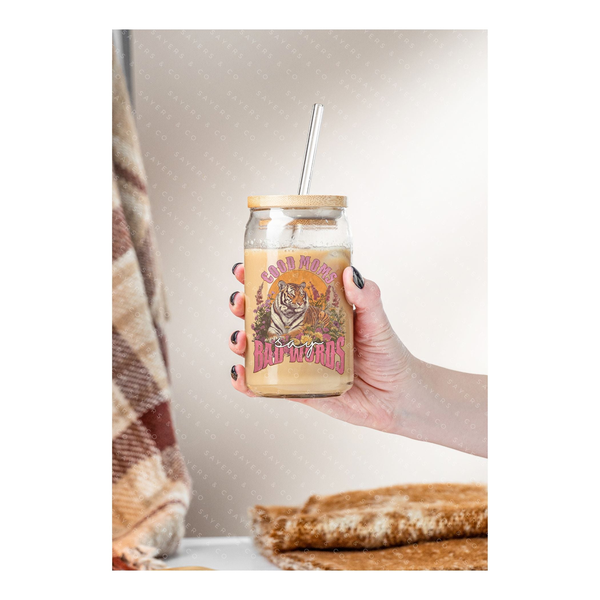16oz Good Moms Say Bad Words Glass Cup with bamboo lid and straw, showcasing a humorous design perfect for moms and teachers.