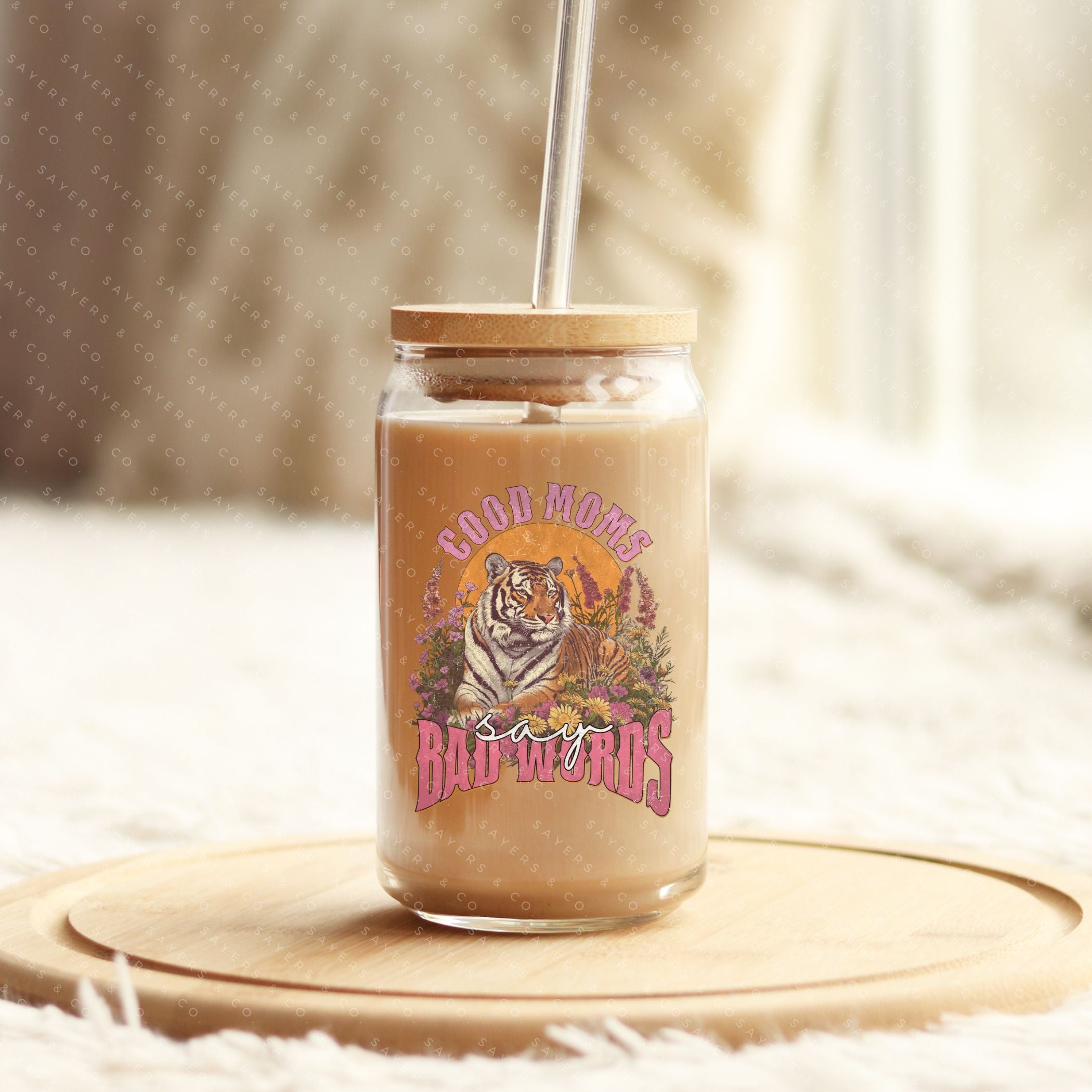16oz Good Moms Say Bad Words Glass Cup with bamboo lid and straw, showcasing a humorous design perfect for moms and teachers.