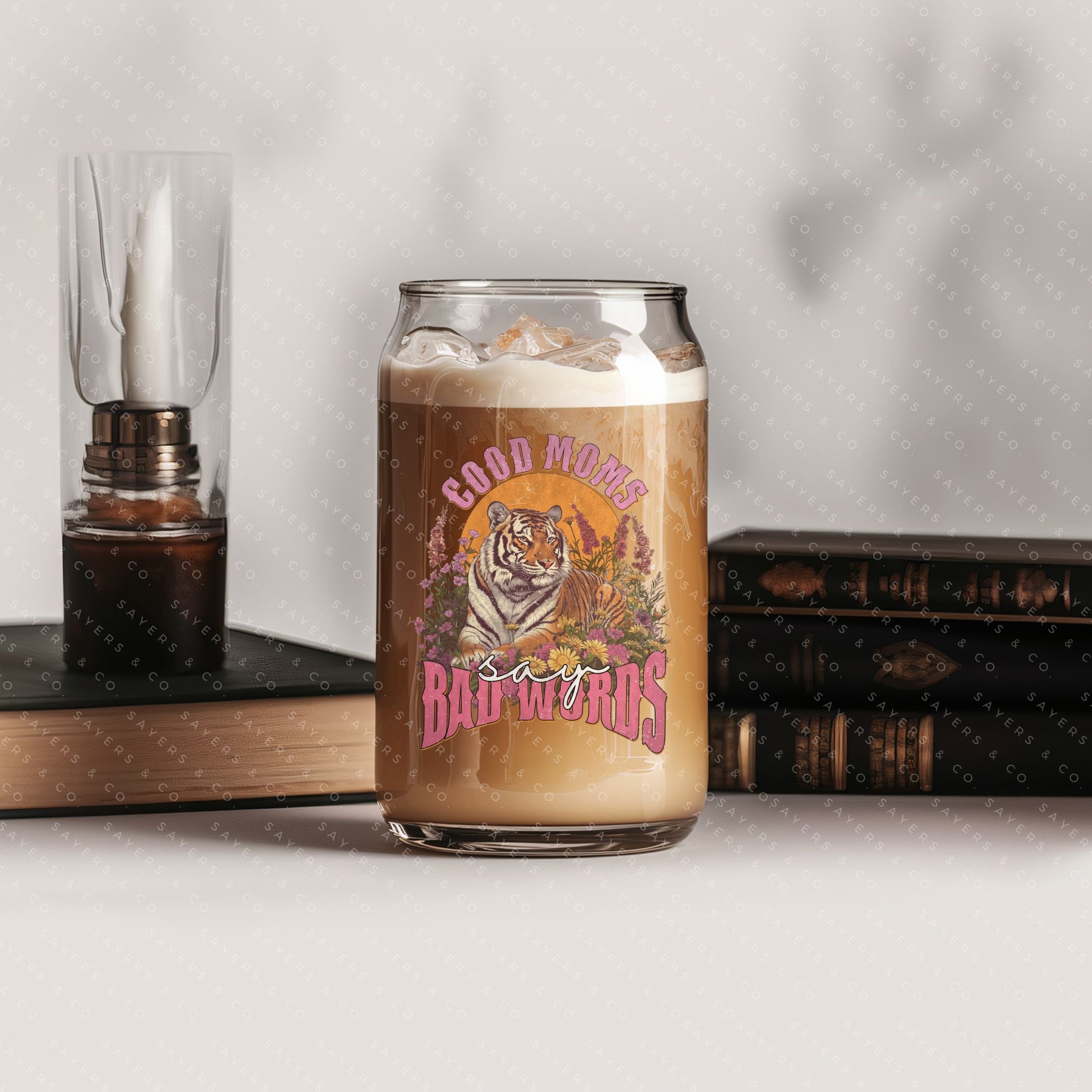 16oz Good Moms Say Bad Words Glass Cup with bamboo lid and straw, showcasing a humorous design perfect for moms and teachers.