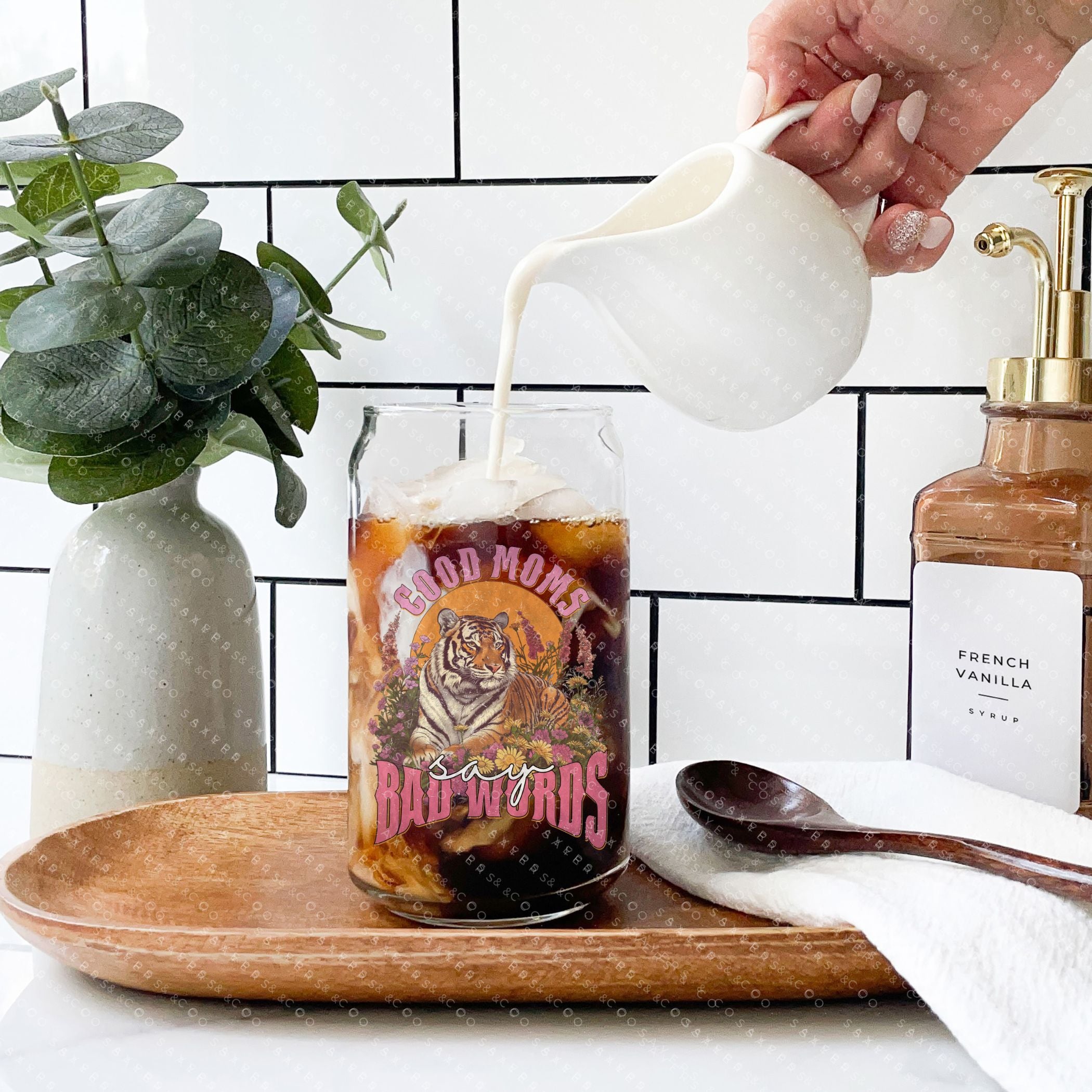 16oz Good Moms Say Bad Words Glass Cup with bamboo lid and straw, showcasing a humorous design perfect for moms and teachers.