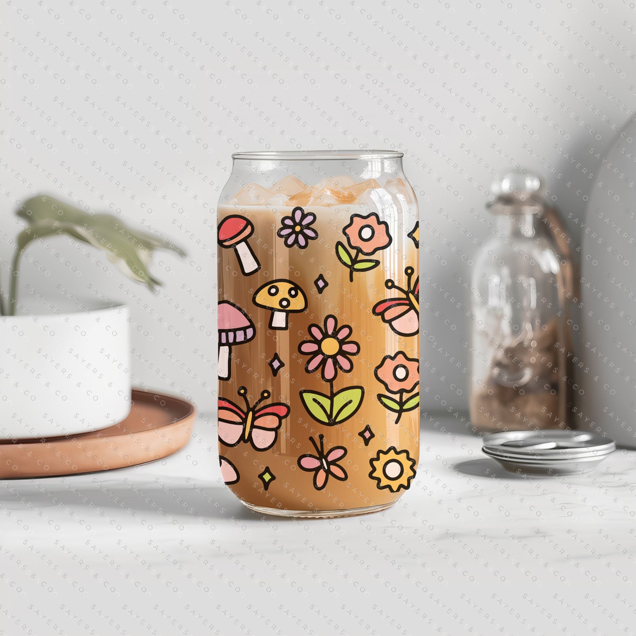 16oz Happy Fields Glass Cup with bamboo lid and straw, showcasing a vibrant design perfect for summer drinks.