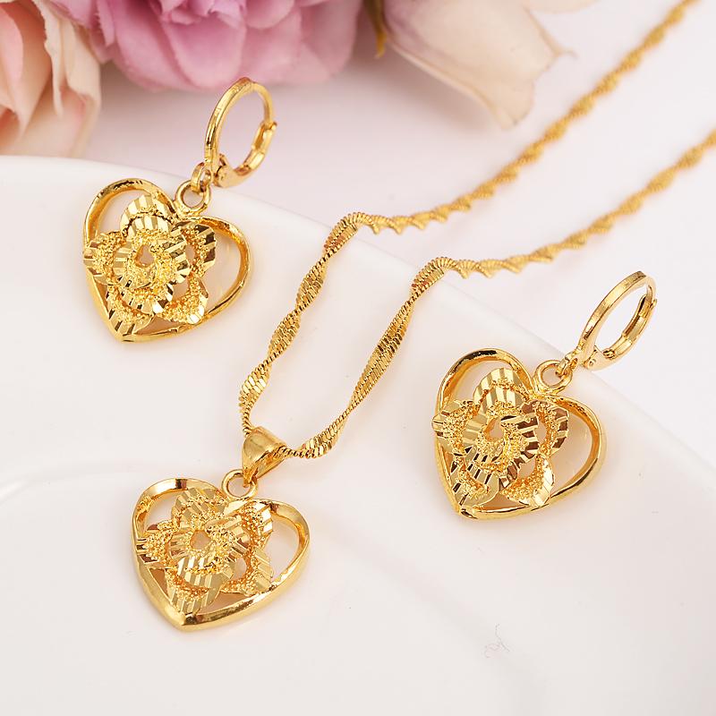 Elegant 18k Fine Solid Gold GF Outline Border Heart Flower jewelry set for women, showcasing a beautiful heart flower design.