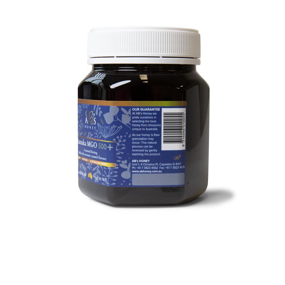 1Kg jar of AB's MGO 500+ Australian Manuka Honey, showcasing its rich dark color and natural packaging.