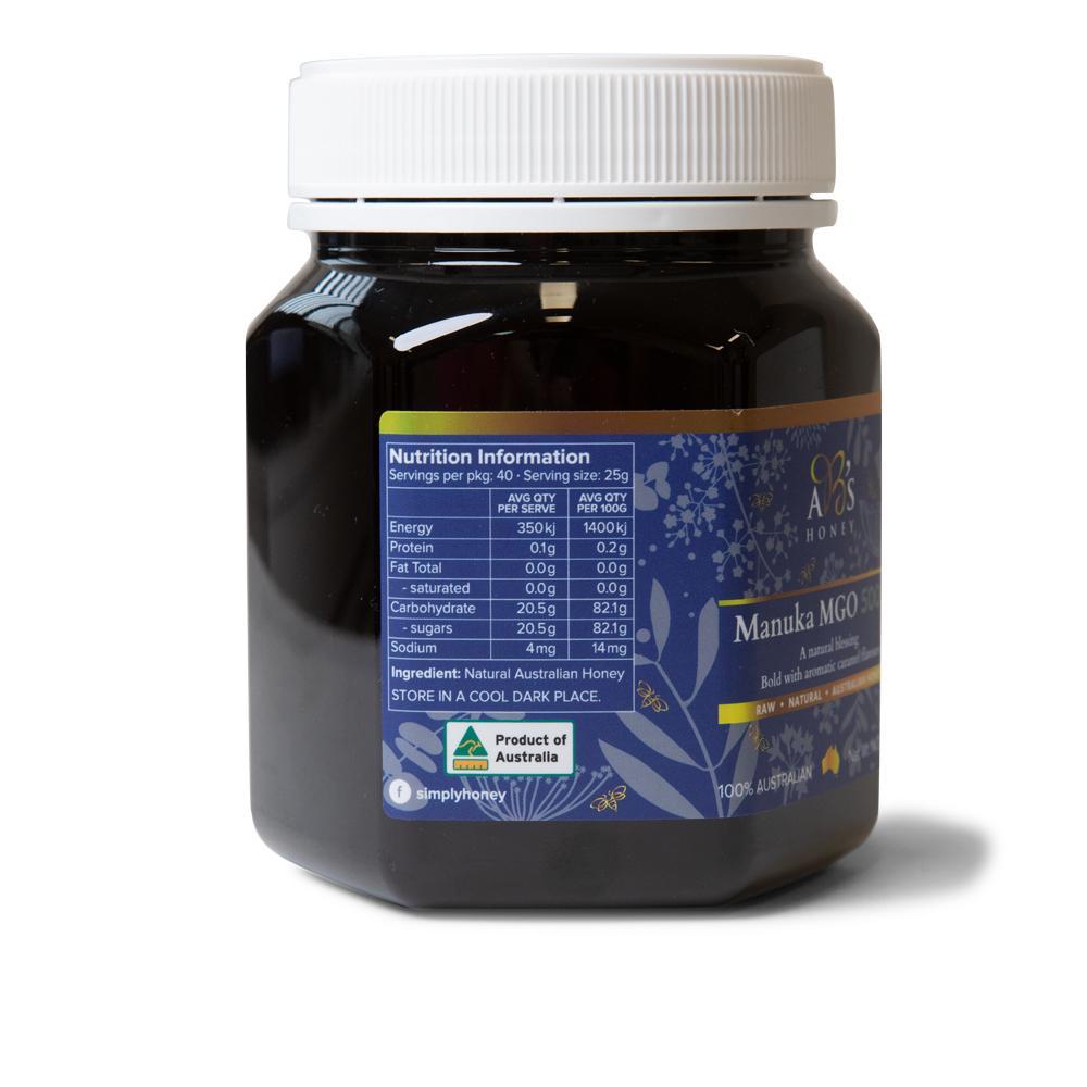1Kg jar of AB's MGO 500+ Australian Manuka Honey, showcasing its rich dark color and natural packaging.