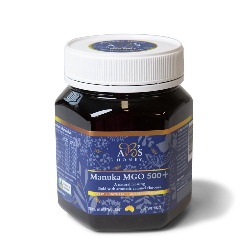 1Kg jar of AB's MGO 500+ Australian Manuka Honey, showcasing its rich dark color and natural packaging.