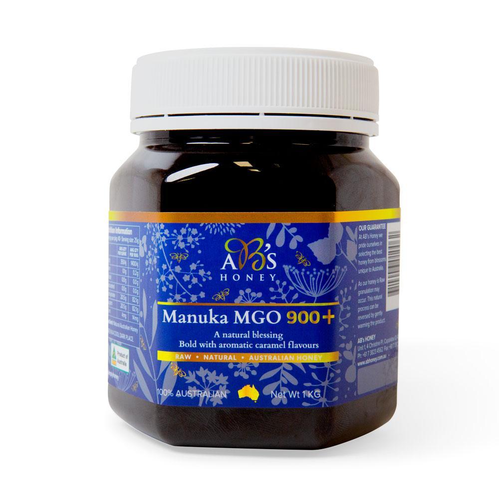 1Kg jar of AB's MGO 900+ Australian Manuka Honey, showcasing its rich dark color and natural packaging.