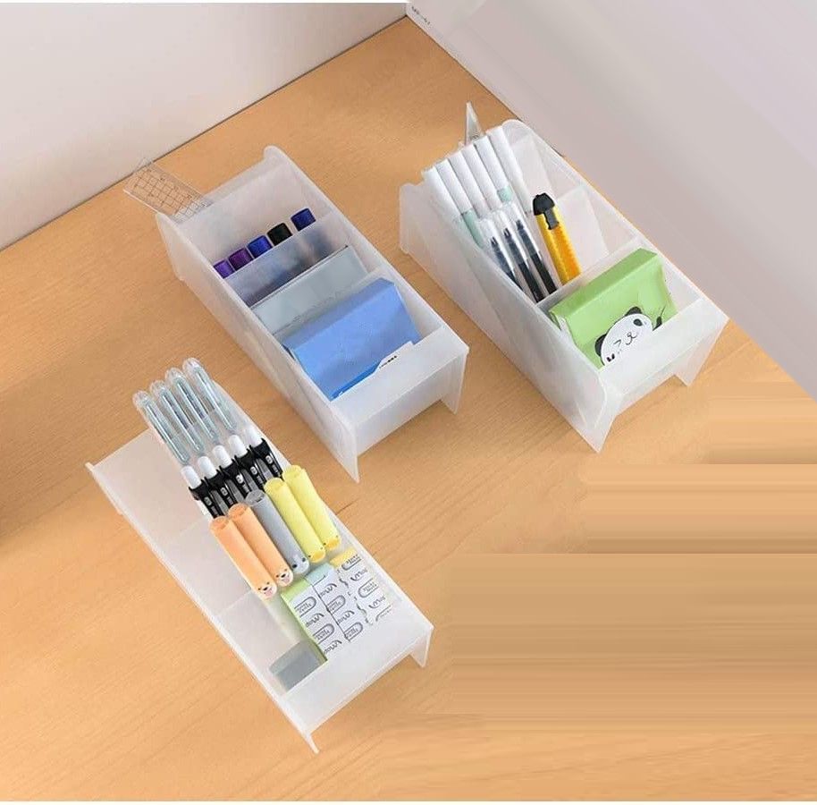 Two trapezoidal desktop storage units in clear colors, ideal for organizing office and school supplies.