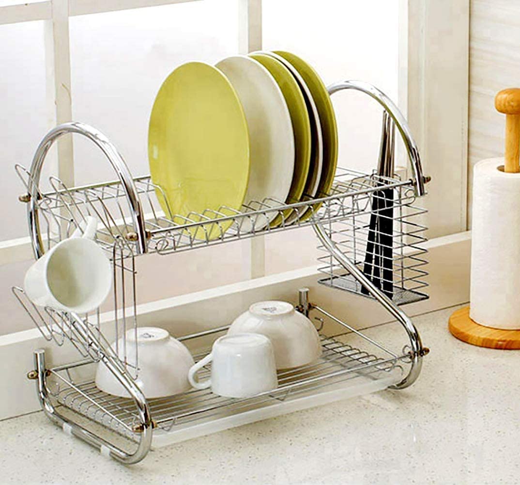 2 Tier Dish Rack with Drain Board, chrome finish, holding plates and utensils on a kitchen counter.