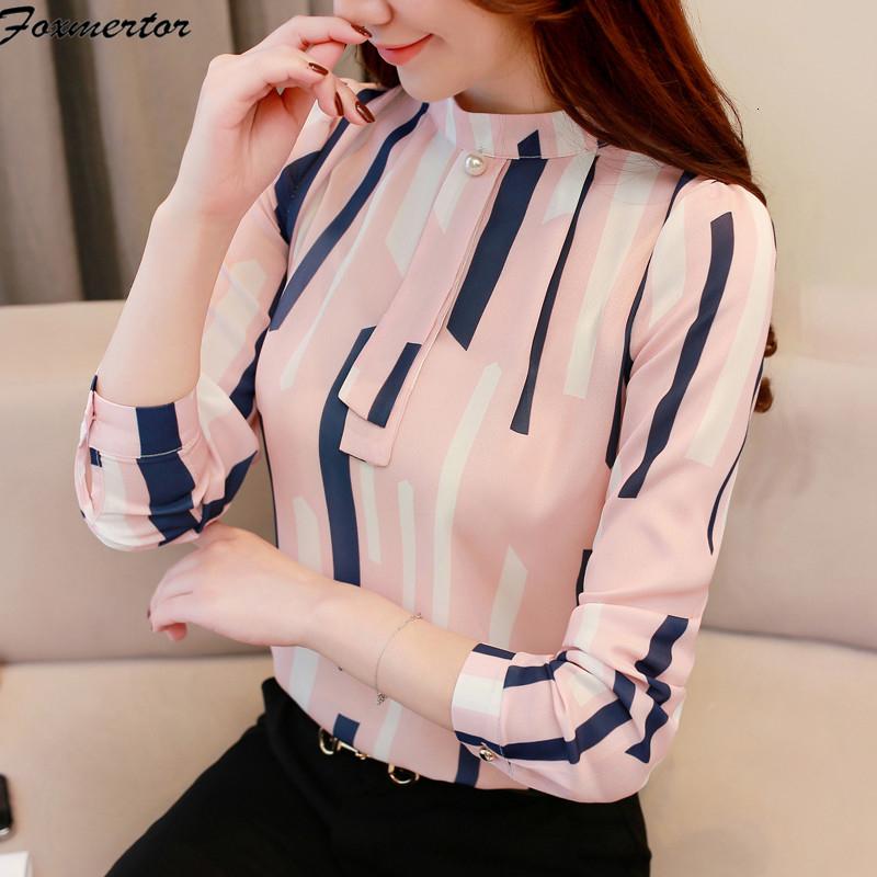 A stylish long-sleeved blouse for women featuring a trendy striped pattern and V-neck collar, available in multiple colors.