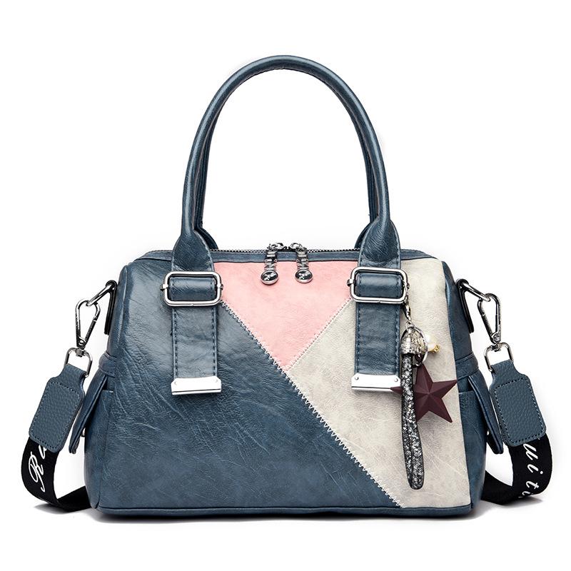 2020 New Arrival Handbag in Korean style, featuring a trendy patchwork design and a zipper closure, perfect for women's fashion.