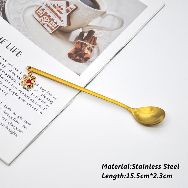 A beautifully designed Creative Metal Merry Christmas Spoon in gold with a Christmas pendant, perfect for holiday celebrations.