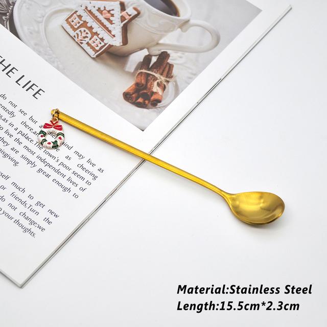 A beautifully designed Creative Metal Merry Christmas Spoon in gold with a Christmas pendant, perfect for holiday celebrations.