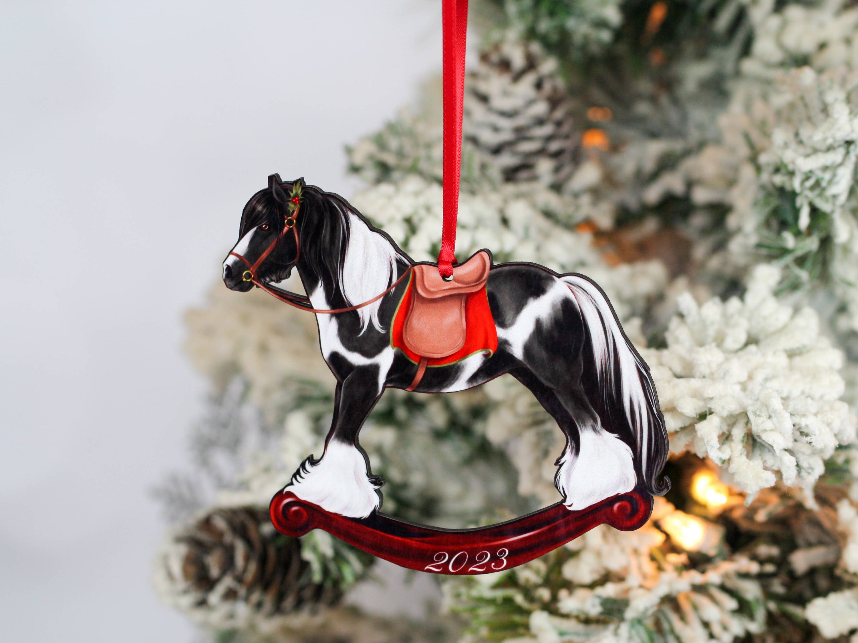 2023 Black Tobiano Gypsy Rocking Horse Christmas Ornament, handmade from composite wood with a glossy finish, featuring intricate laser-cut details.