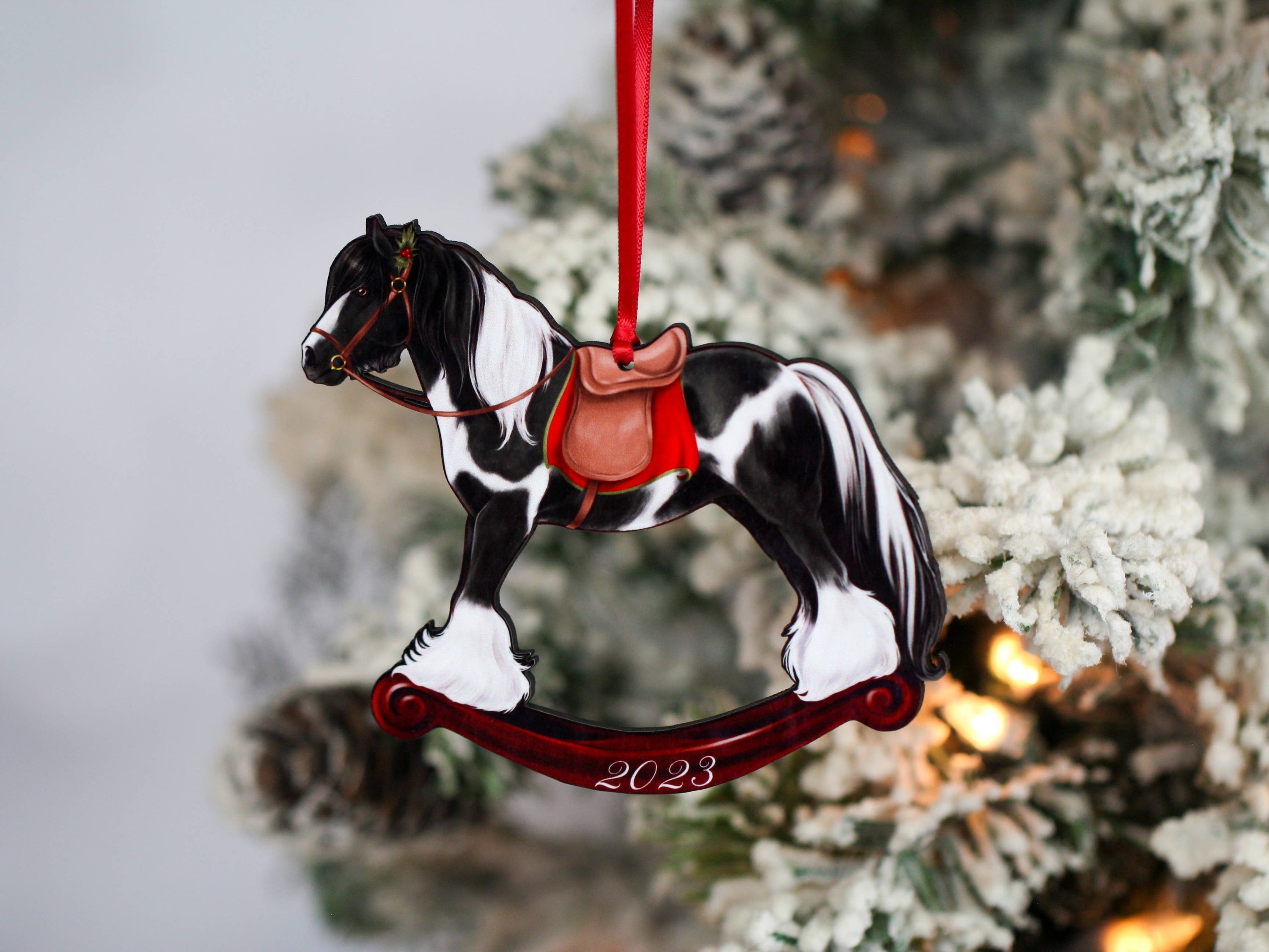 2023 Black Tobiano Gypsy Rocking Horse Christmas Ornament, handmade from composite wood with a glossy finish, featuring intricate laser-cut details.