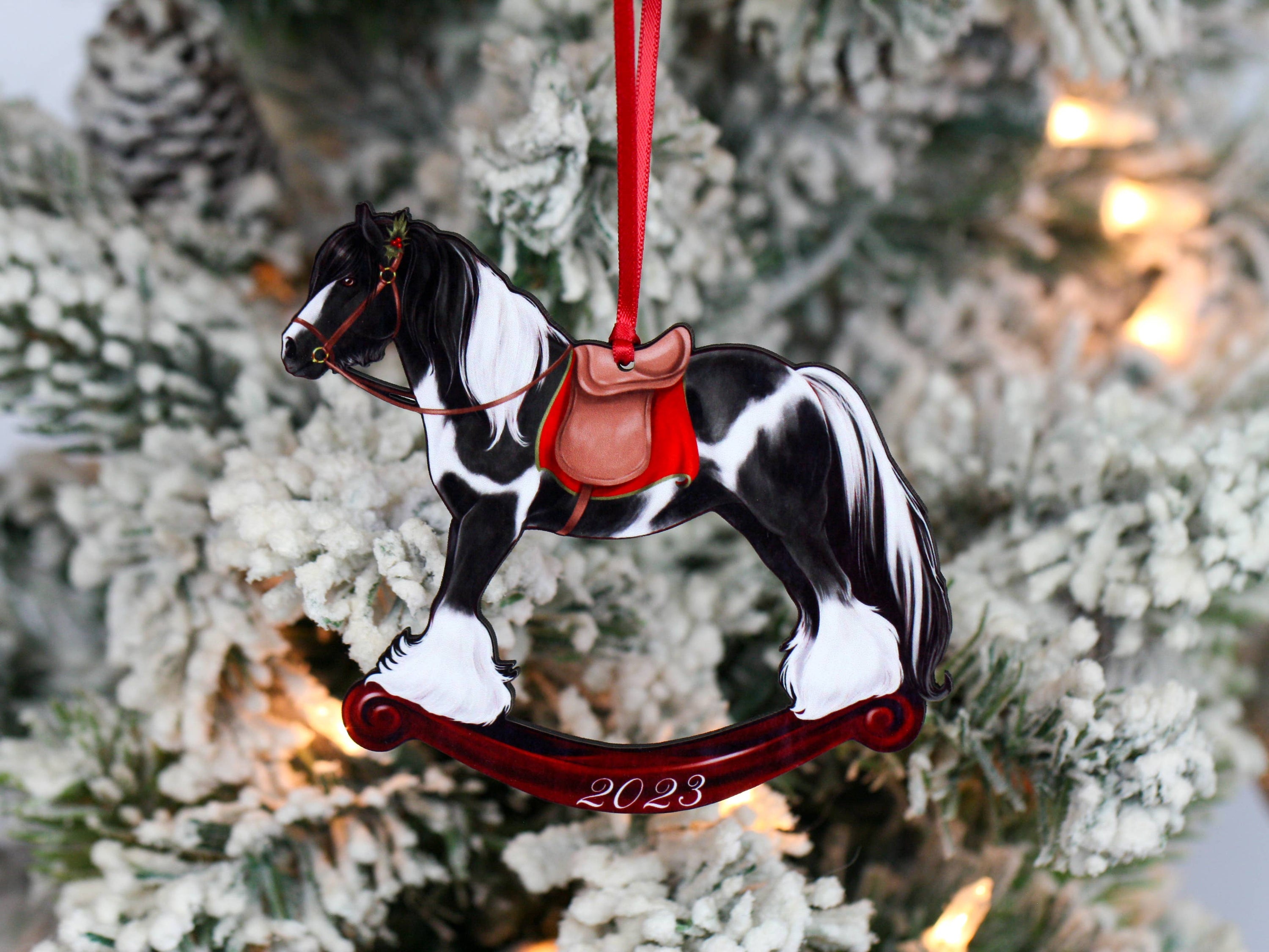 2023 Black Tobiano Gypsy Rocking Horse Christmas Ornament, handmade from composite wood with a glossy finish, featuring intricate laser-cut details.