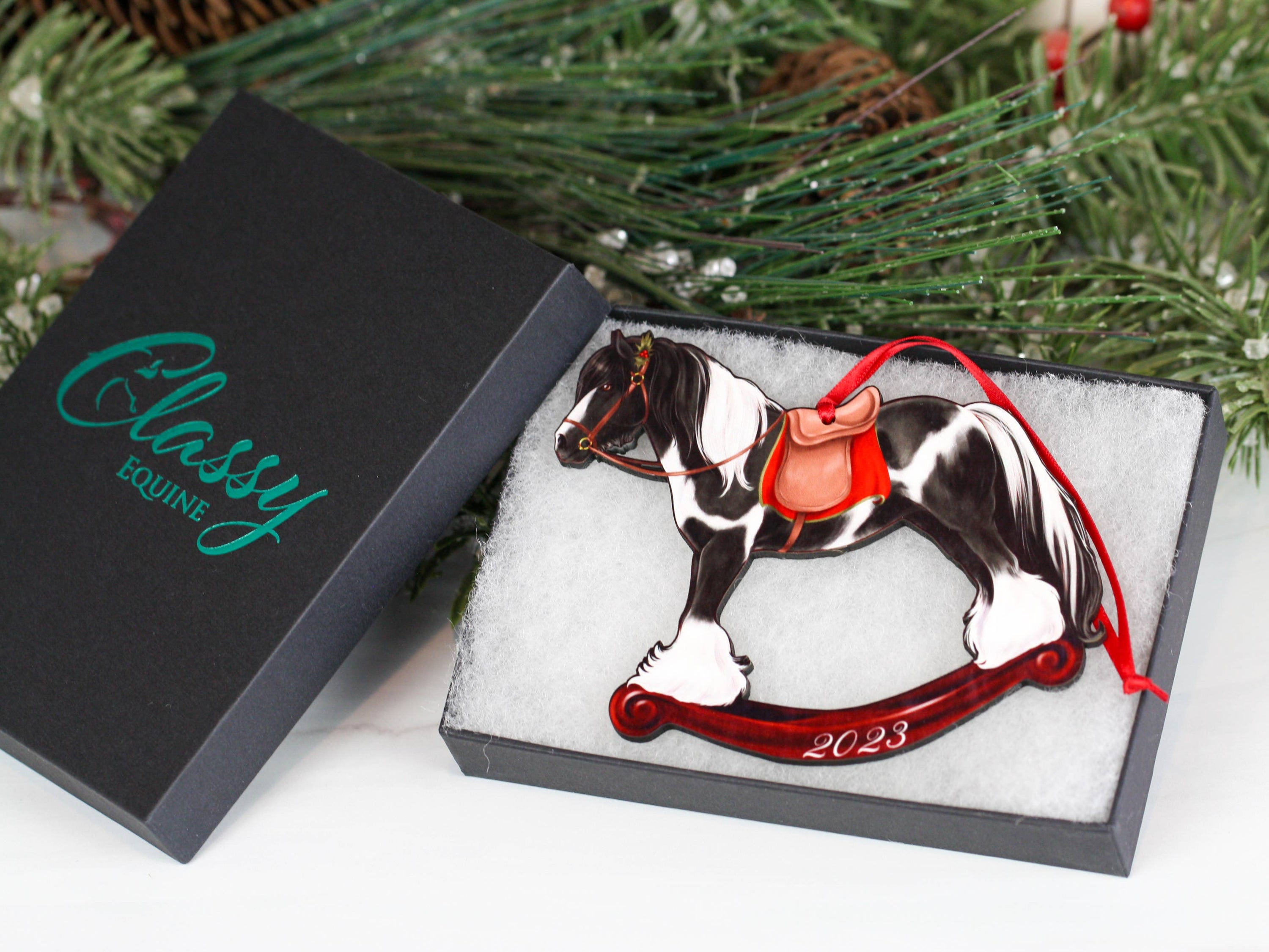 2023 Black Tobiano Gypsy Rocking Horse Christmas Ornament, handmade from composite wood with a glossy finish, featuring intricate laser-cut details.