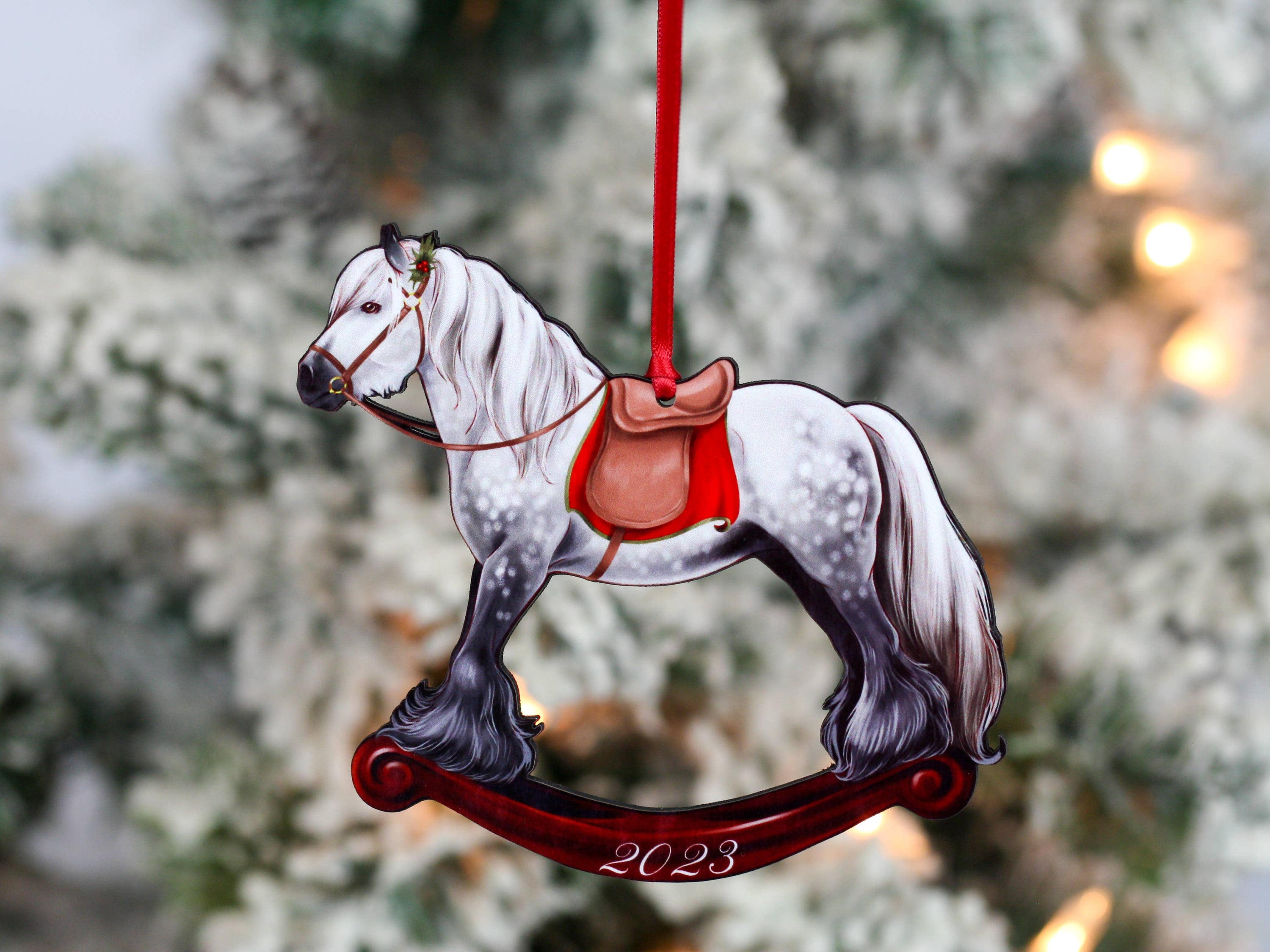 2023 Gray Gypsy Rocking Horse Christmas Ornament, handmade from composite wood with a glossy finish, featuring red and black ribbons.