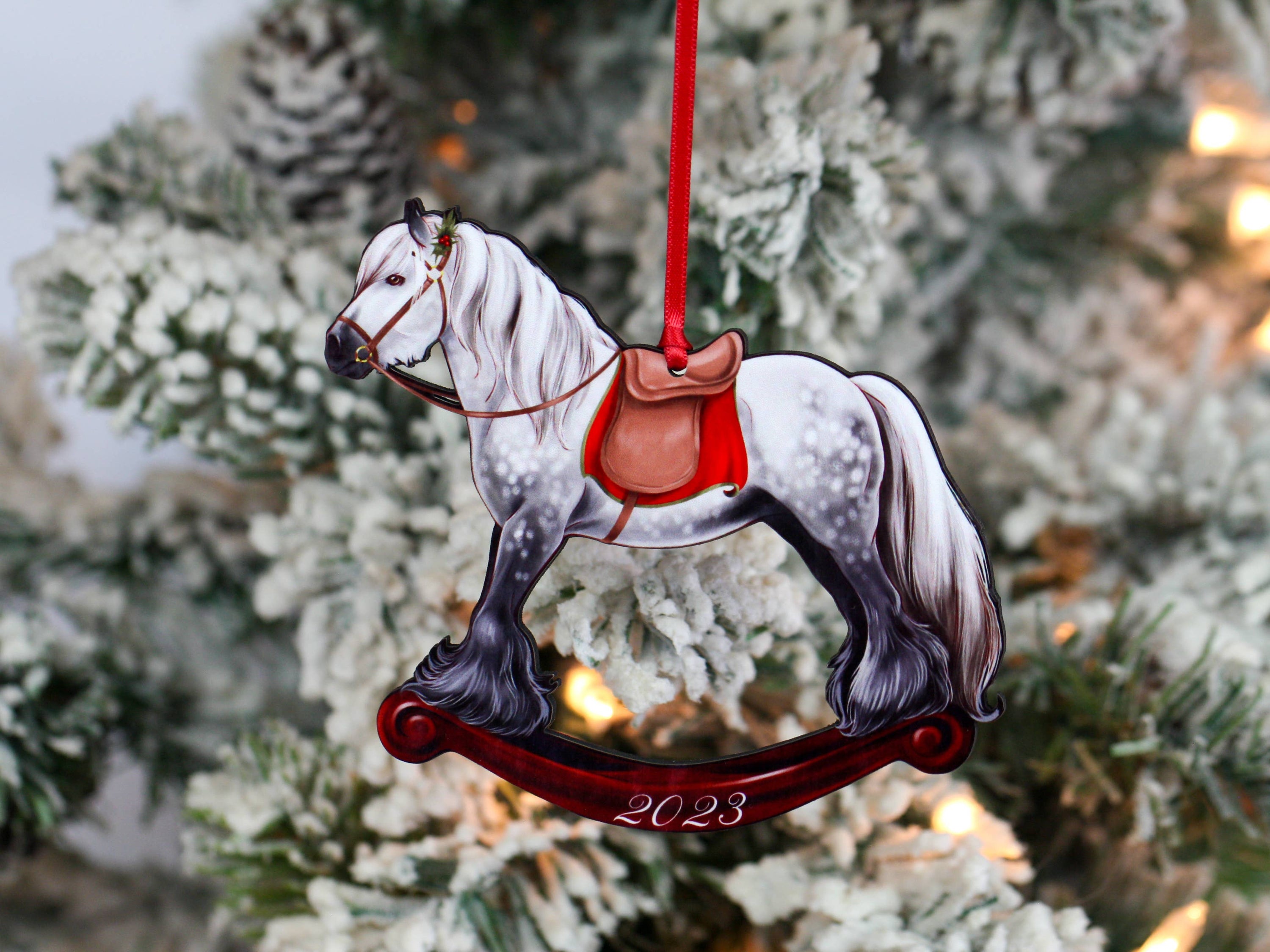 2023 Gray Gypsy Rocking Horse Christmas Ornament, handmade from composite wood with a glossy finish, featuring red and black ribbons.