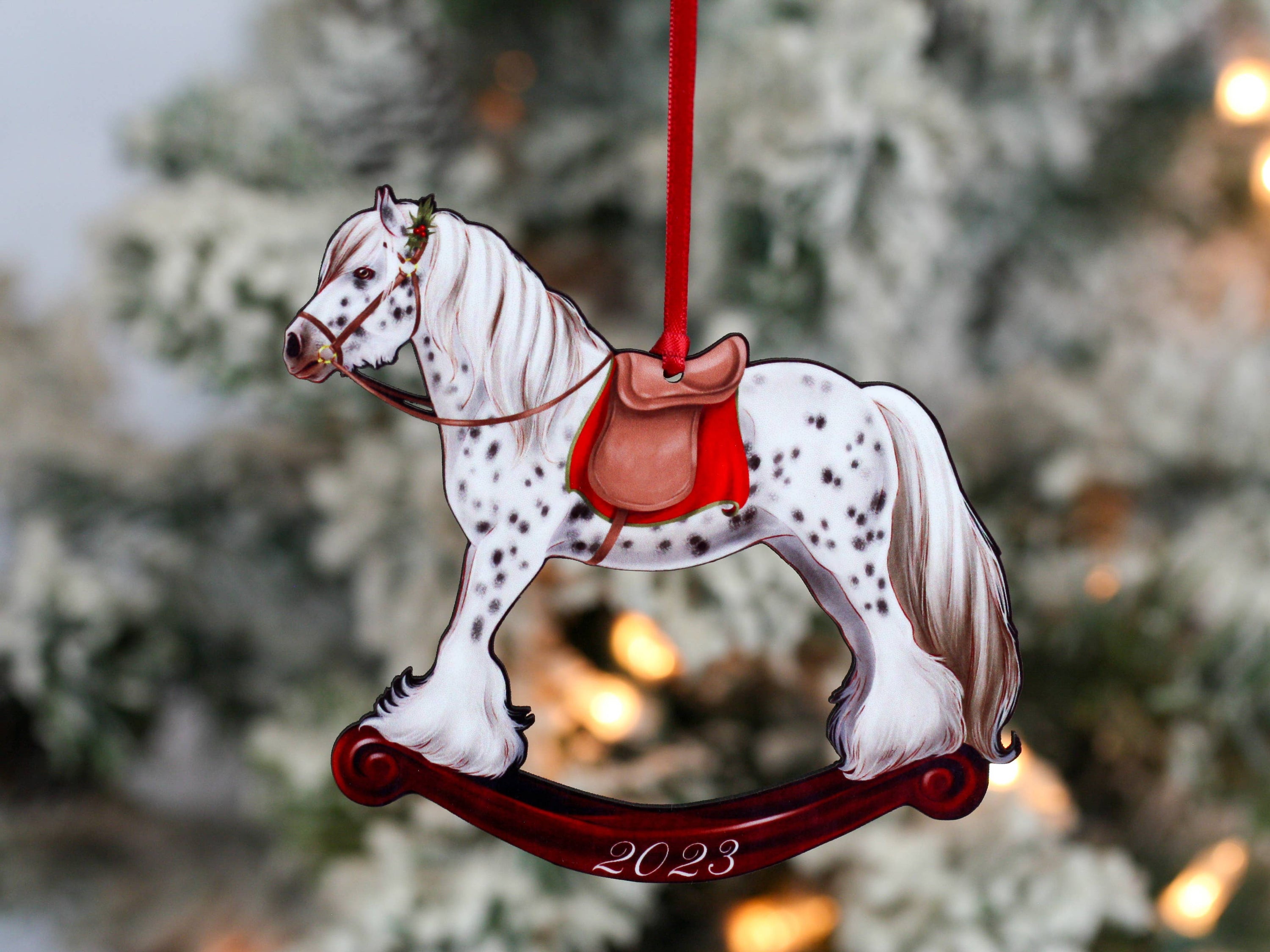 2023 Spotted Gypsy Cob Rocking Horse Christmas Ornament, handmade from composite wood with a glossy finish, featuring red and black ribbons.