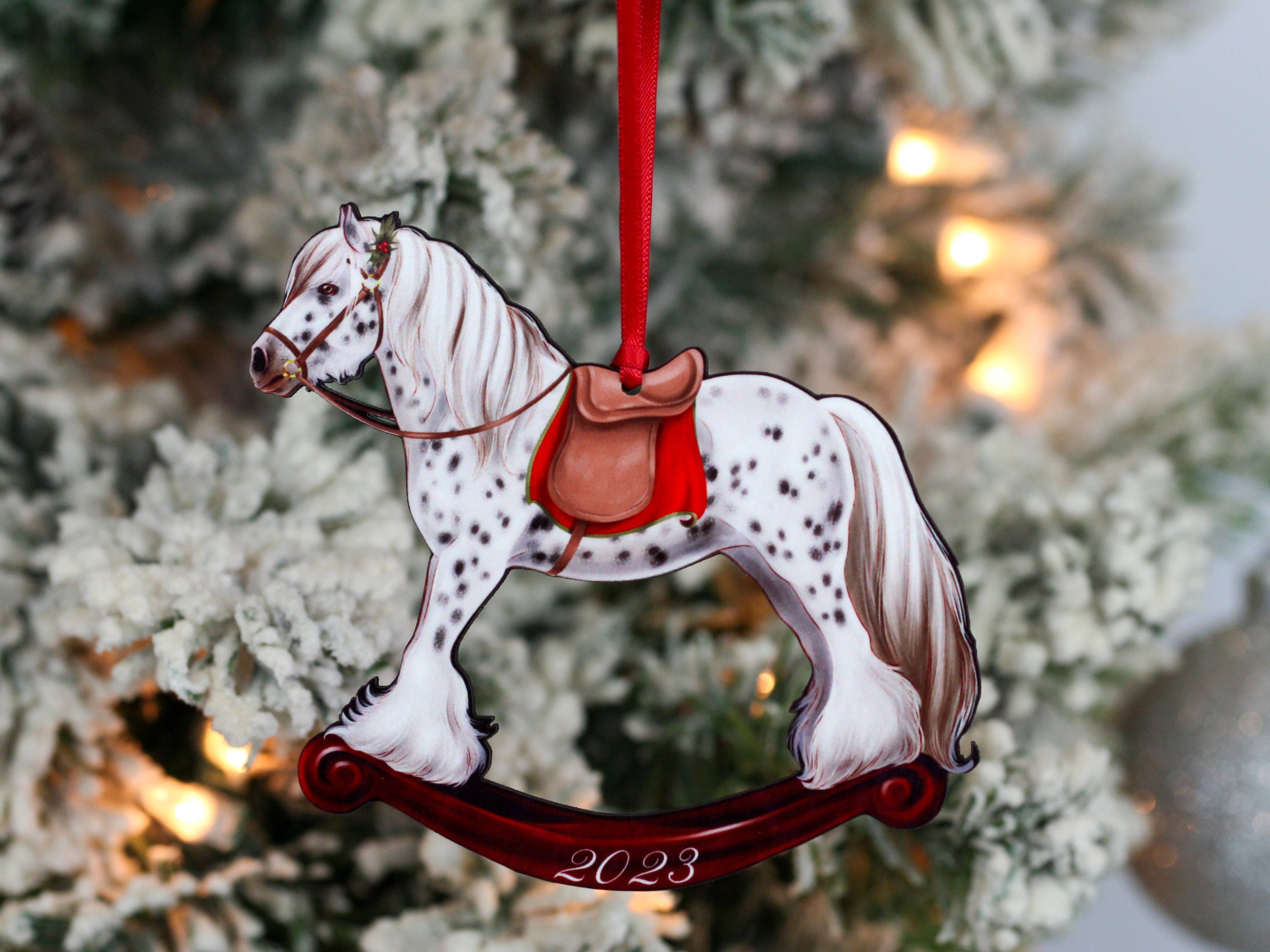 2023 Spotted Gypsy Cob Rocking Horse Christmas Ornament, handmade from composite wood with a glossy finish, featuring red and black ribbons.