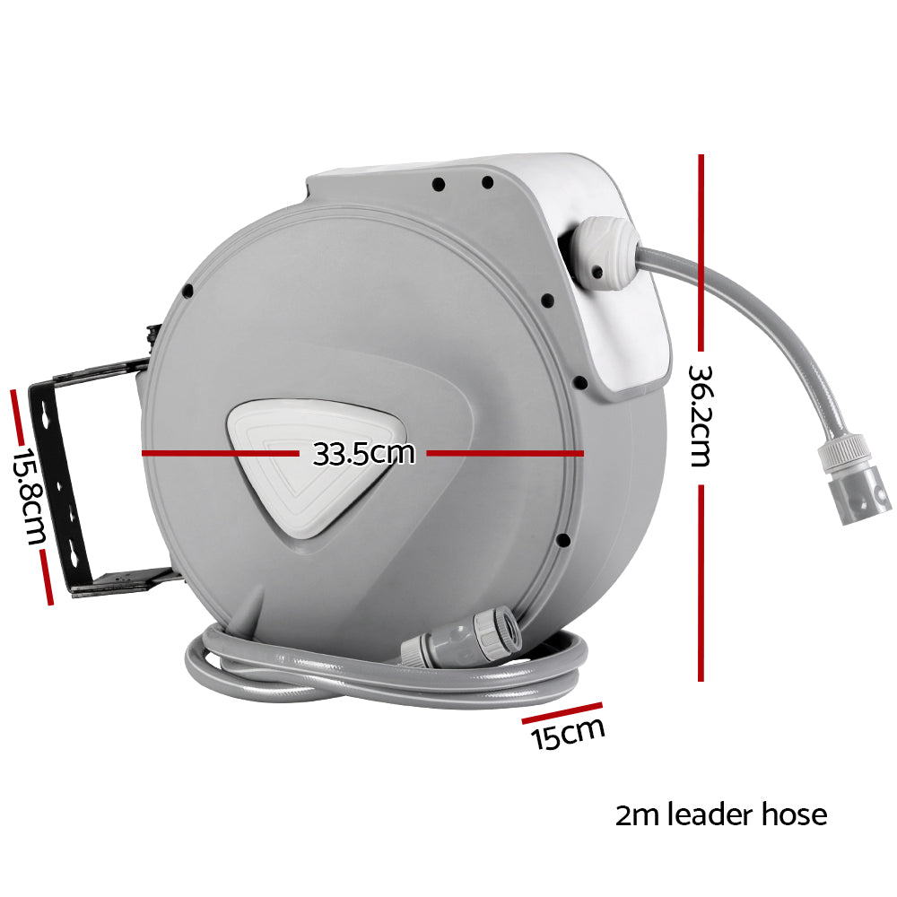 A sleek grey 20M retractable water hose reel mounted on a wall, featuring a spray gun with nine adjustable settings.