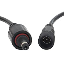 Three LED solar spotlights with a black finish, designed for outdoor use, showcasing their waterproof features and bright warm white light.